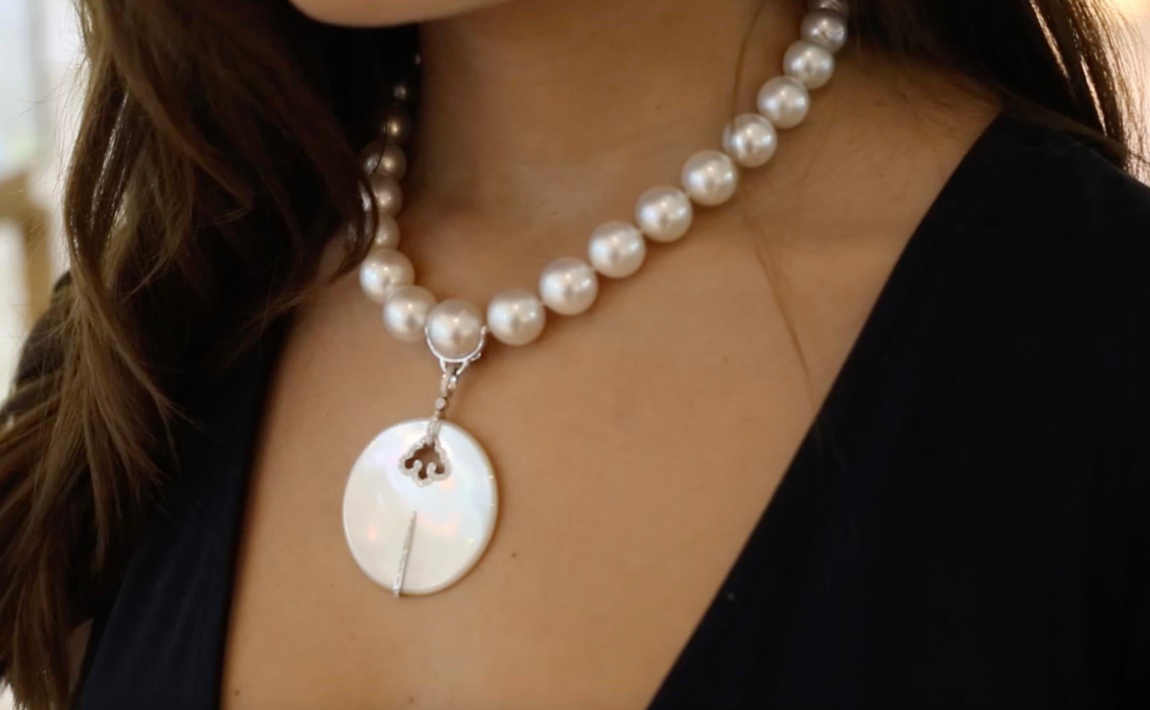 Superb and Smart Adler Mother of Pearl and Diamond on white gold Important Pendant of contemporary Art Deco design Asian inspiration. Removable bail. 
Hanging on a White culture Pearl Necklace with a Diamond and White gold 18k sphere design