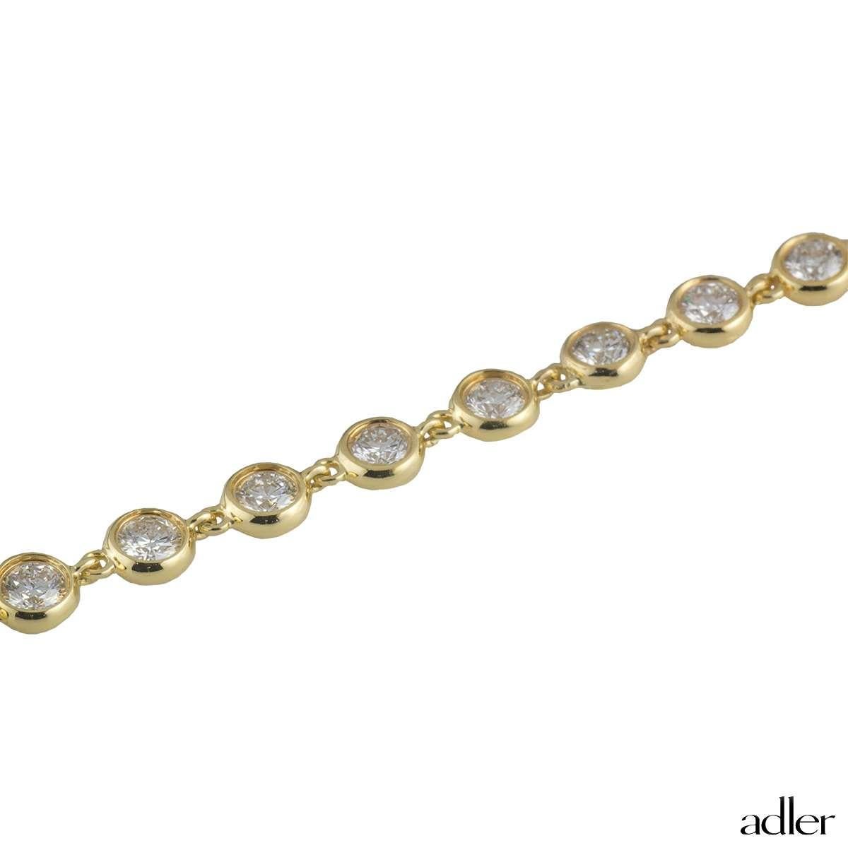 An impressive diamond line necklace in 18k yellow gold by Adler. The necklaces comprises of 172 individually set round brilliant cut diamonds in a rubover setting totalling approximately 17.20ct, predominantly G-H in colour and VS clarity. The