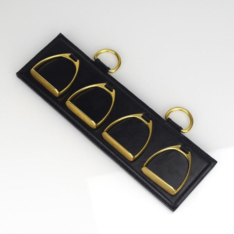 Adnet Style Gilt Brass and Leather Horsebit Scarf Holder by Longchamp, Paris

The Adnet-style gilt brass and leather horsebit scarf holder by Longchamp, Paris, is nothing less than an art piece! This modern-style accessory, hailing from the renowned