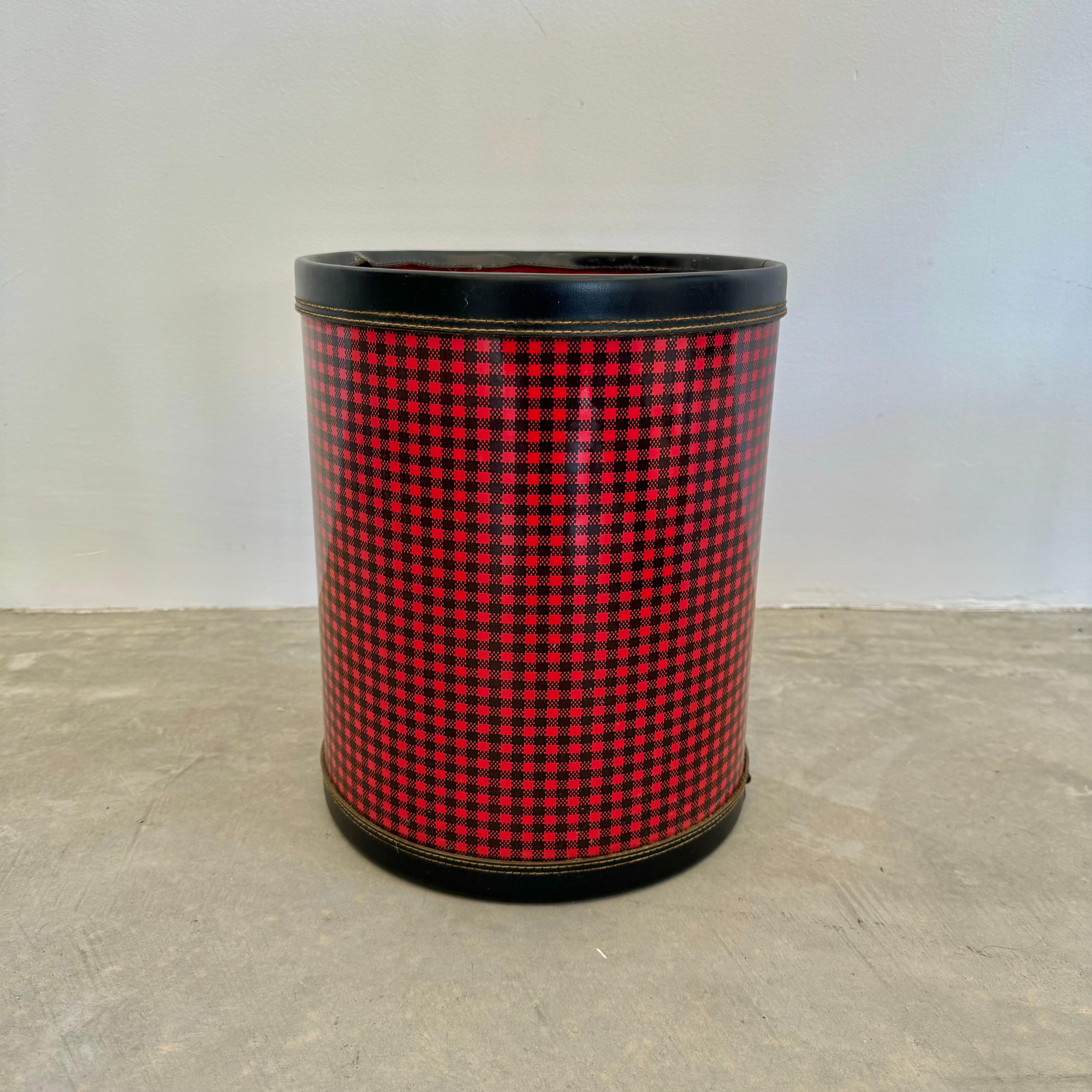 A unique and fun waste bin in a vibrant red and black buffalo check plaid. Made in the style of Jacques Adnet. Presents well and adds great personality to a room. Made of a hardy plastic that stands up to wear.

Located at our Los Angeles showroom.
