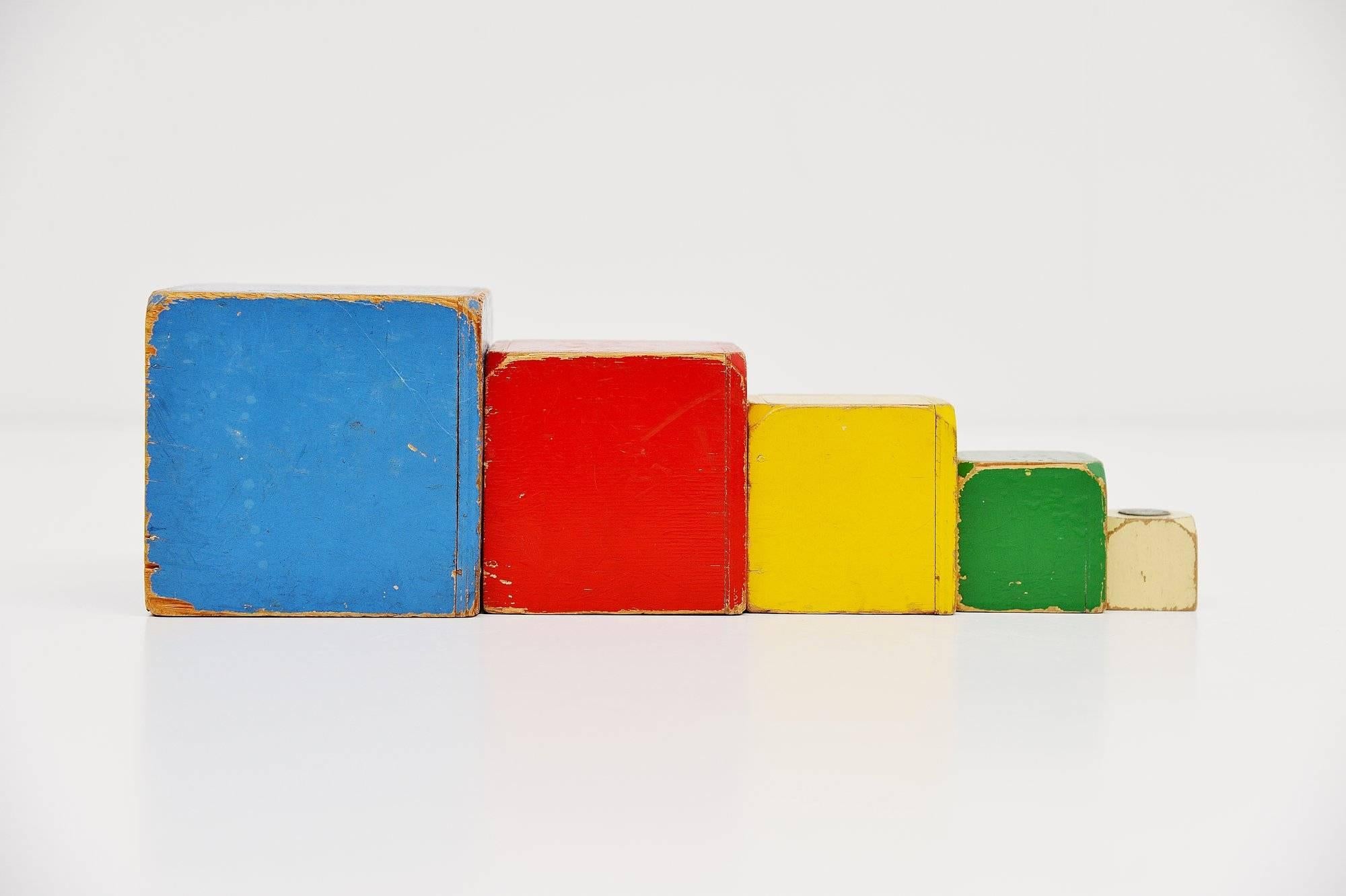 Very nice decorative wooden toy cubes set, designed by Ko Verzuu for Ado Holland in the 1950s. Ado means Arbeid door onvolwaardigen, translated; labor by incapacitated, which makes this an even more special piece. Toys by Ado are being highly