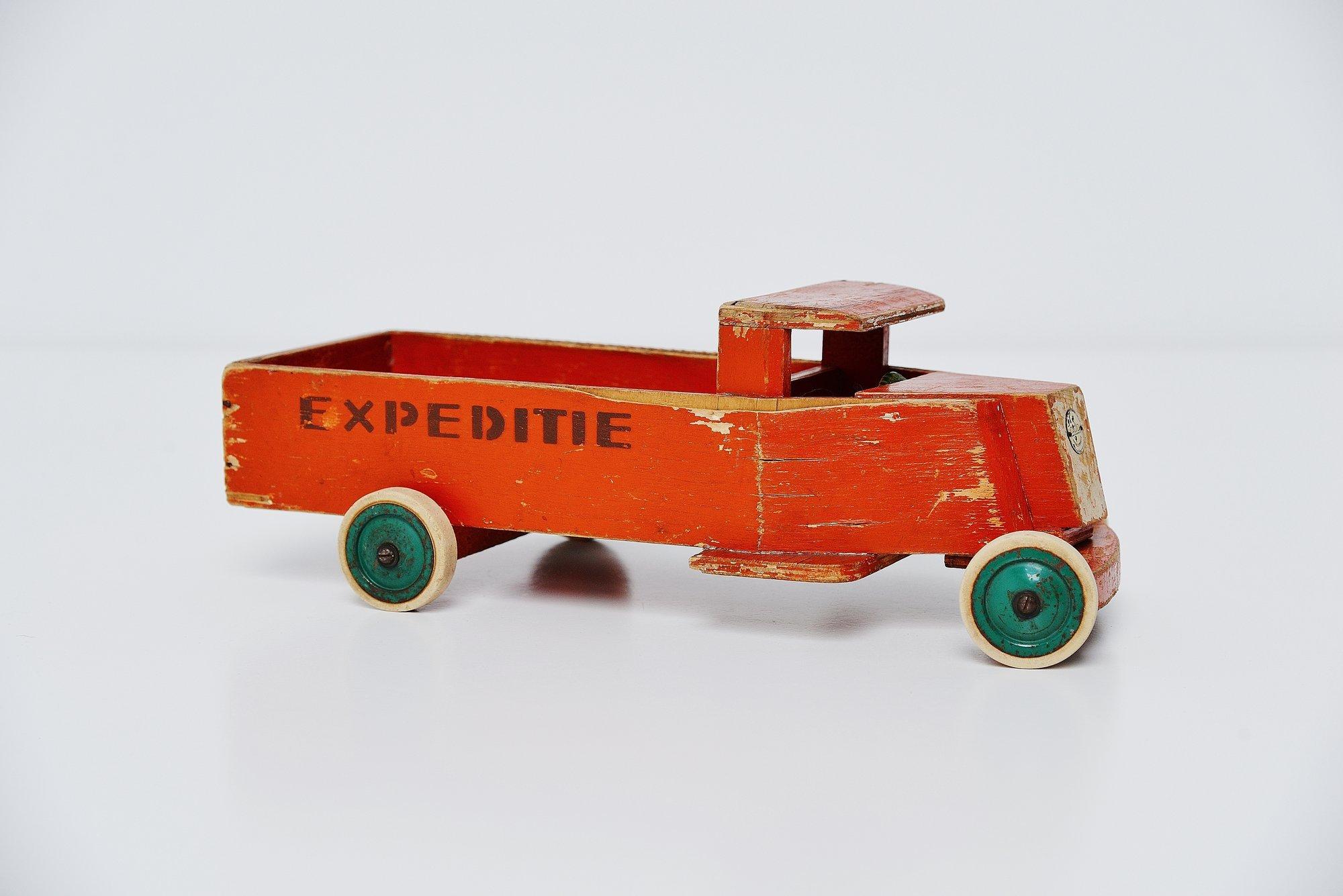 Very nice decorative wooden toy truck ‘Expeditie’ (expedition) model 941, designed by Ko Verzuu for Ado Holland in the 1939.  Ado means Arbeid door onvolwaardigen, translated; labor by incapacitated, which makes this an even more special piece. Toys