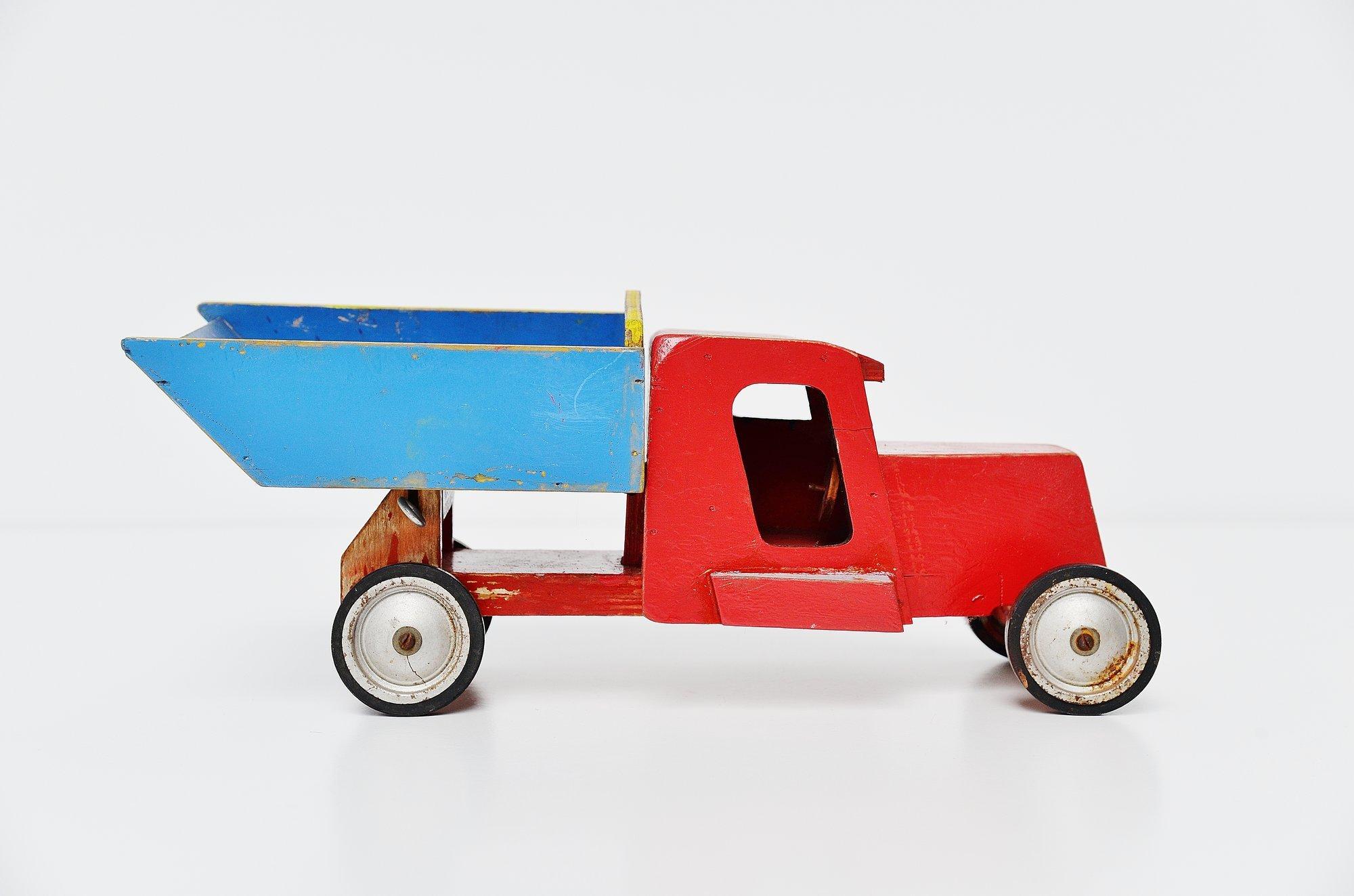 Very nice large toy truck designed by Ko Verzuu for Ado Holland in 1948. Ado means Arbeid door onvolwaardigen, translated; labour by incapacitated, which makes this an even more special piece. Toys by Ado are being highly collected at the moment,