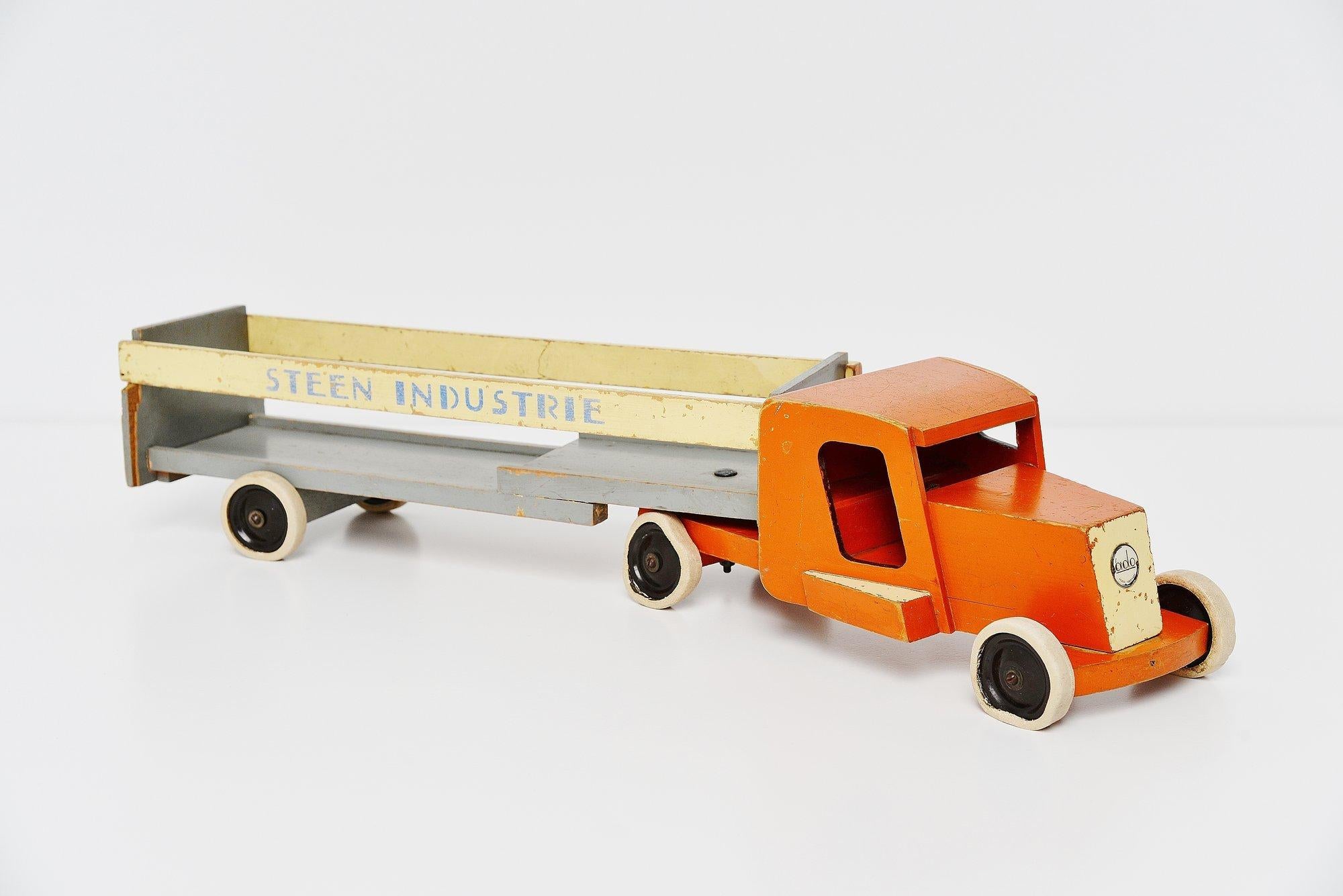 Very nice large ‘Steenindustrie’ (stone industry) toy truck designed by Ko Verzuu for Ado Holland in 1948. Ado means Arbeid door onvolwaardigen, translated; labour by incapacitated, which makes this an even more special piece. Toys by Ado are being