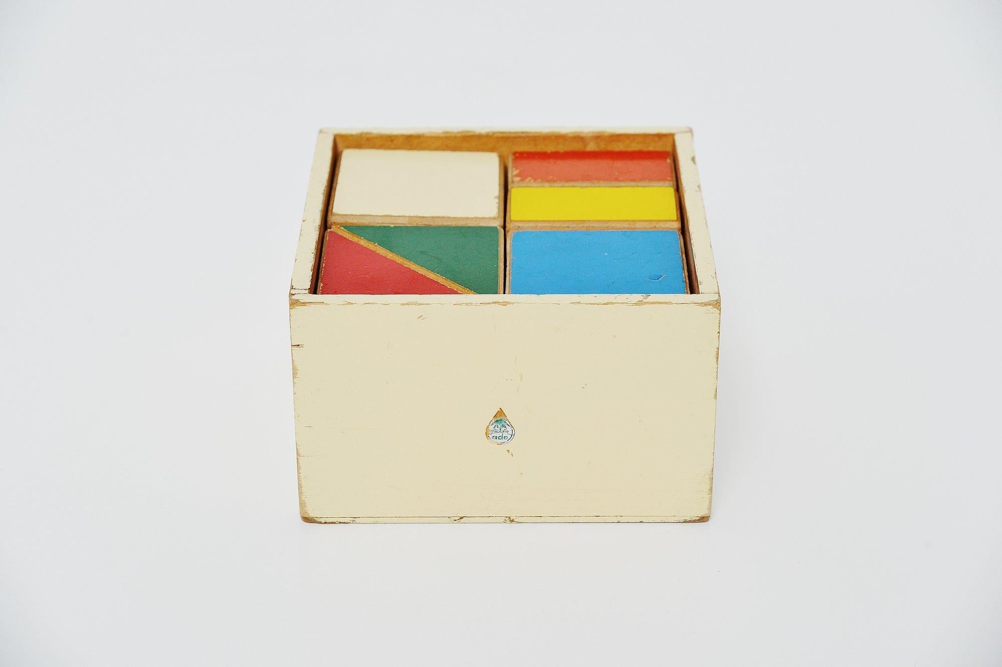 Very nice and highly decorative wooden toy cubes puzzle box model 255, designed by Ko Verzuu for Ado Holland in the 1955. Ado means Arbeid door onvolwaardigen, translated; labour by incapacitated, which makes this an even more special piece. Toys by