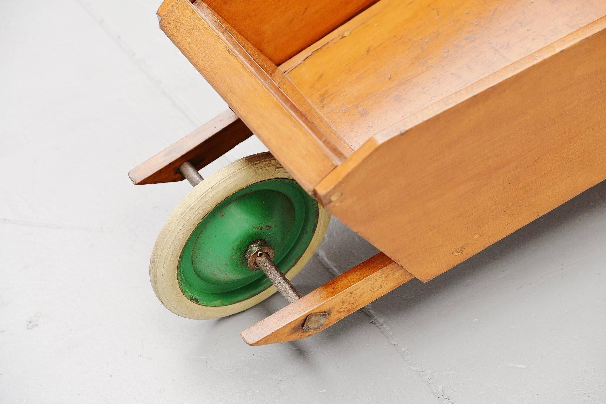 Rare wheelbarrow designed by Ko Verzuu for Ado in circa 1950. Ado means Arbeid door onvolwaardigen, translated; labor by incapacitated, which makes this an even more special piece. Toys by Ado are being highly collected at the moment, even more than