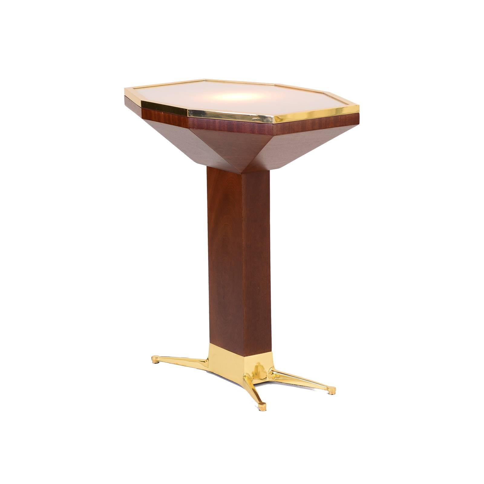 Table designed for the famous Loos-American-Bar at the Kärntner Durchgang in Vienna. Sand casted brass-base, illuminated glass-tabletop.
Now manufactured at the WOKA Workshop in Vienna.

Material: Casted brass base, solid mahogany wood.