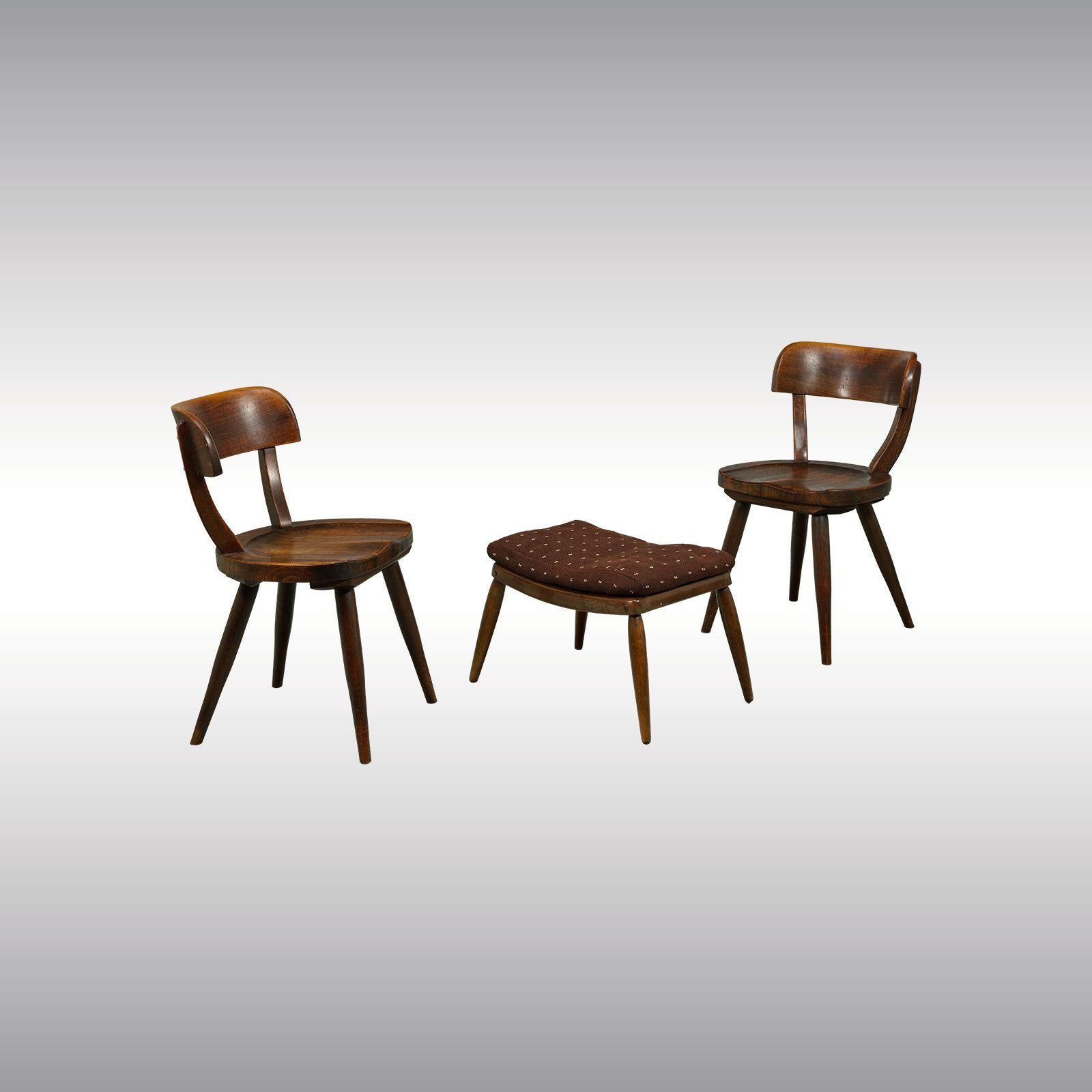 Four-legged structure made of solid beechwood, brown-stained; stool with applied textile added at a later date; professionally restored; signs of age and use; on the underside company label and embossed stamp; measurements: chairs: height 76.8 cm,