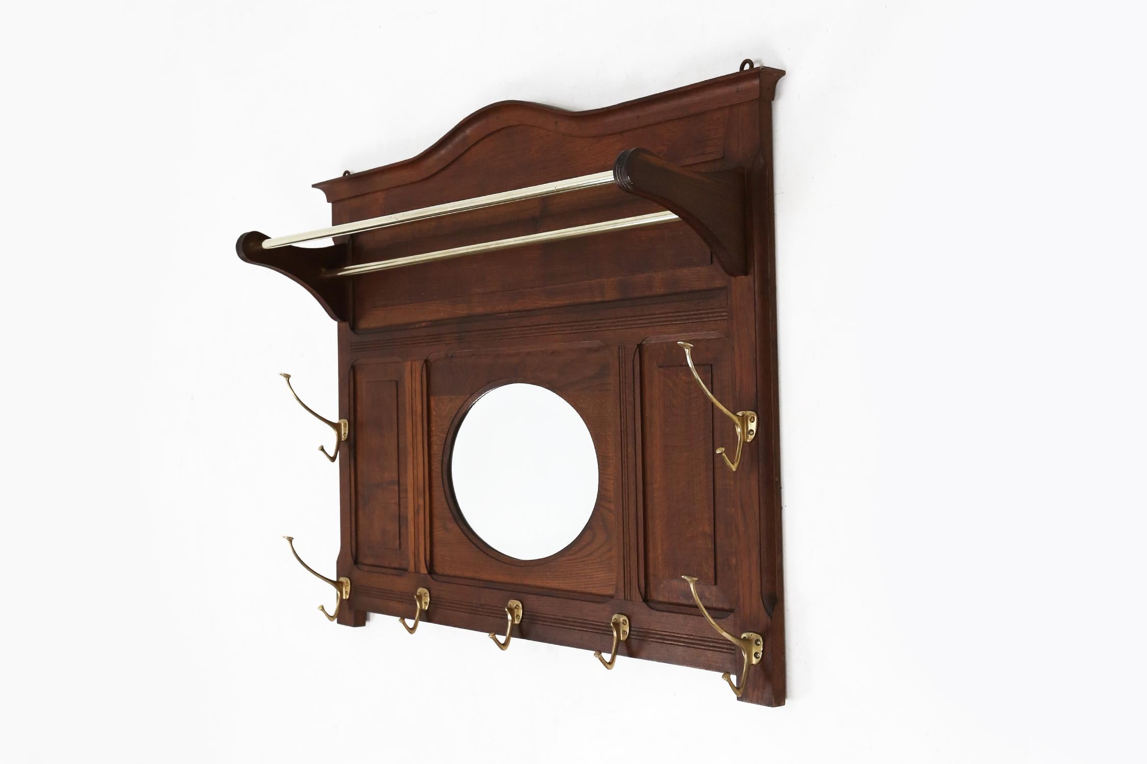 Adolf Loos coat rack with mirror designed in 1916 for the Viennese Cafe Capua. made of solid wood and copper coat hooks.

Adolf Loos was one of the most influential European architects of the late 19th century and is often noted for his literary