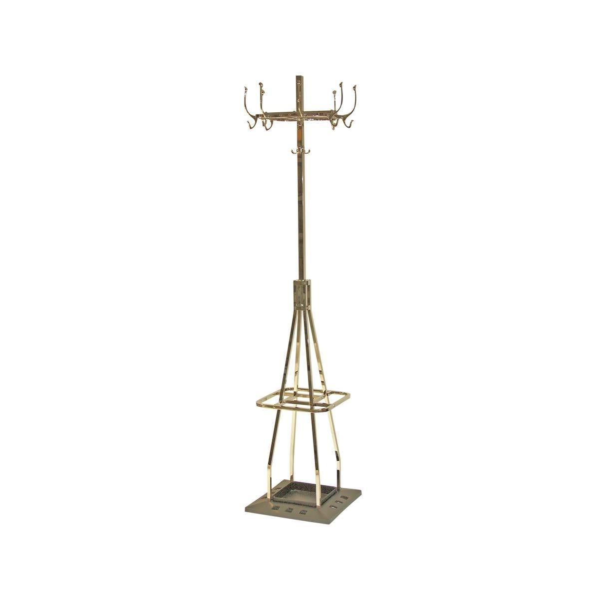 Designed for the Capua Cafe in Vienna in 1913. Upper part turnable / space-saving, umbrella-stand, hat-hook, very heavy base, now manufactured at the WOKA workshop in Vienna. Material: Brass, optionally varnished or nickel-plated, all other finishes