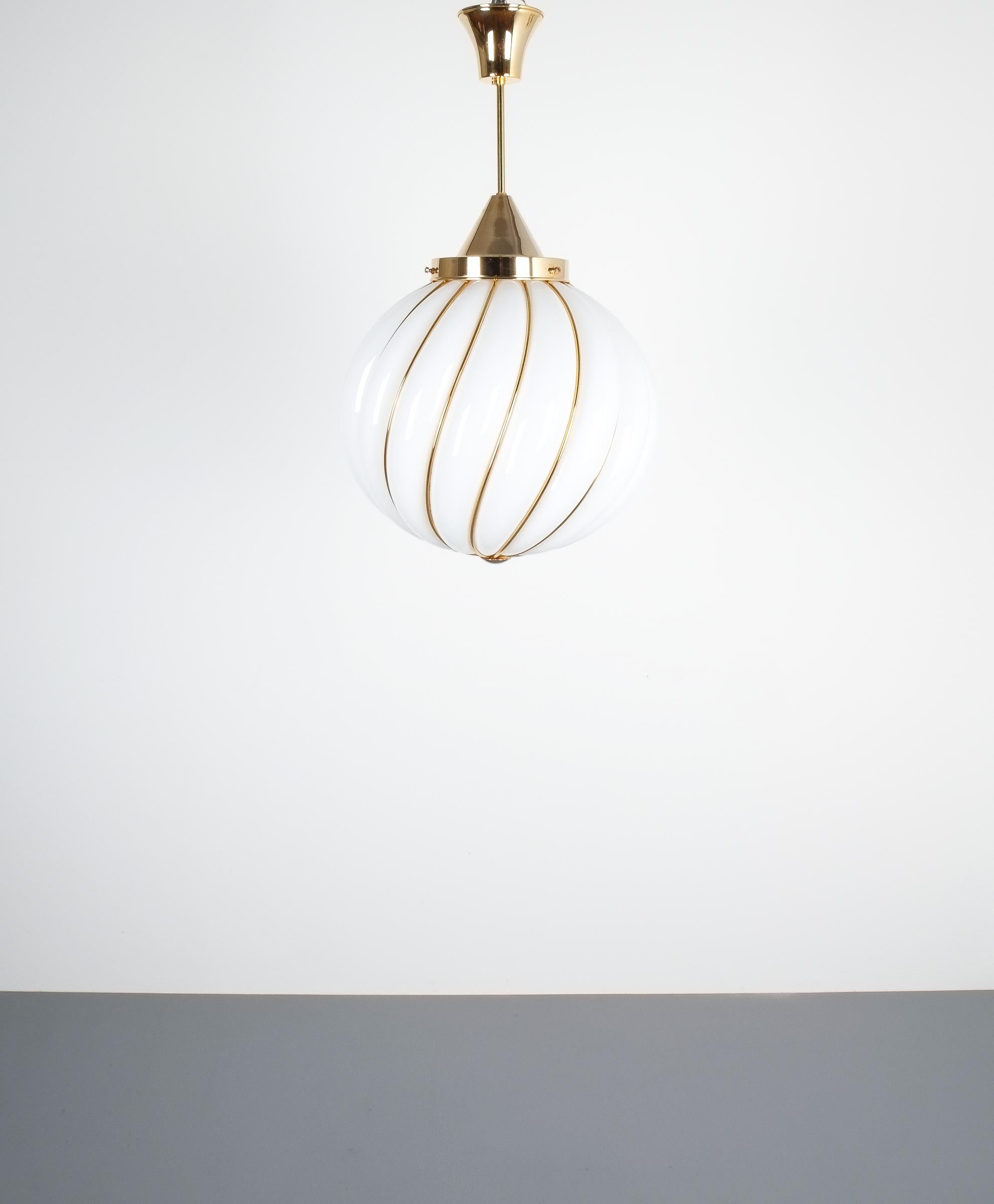 One of three Adolf Loos pendant lamps for VeArt Opal glass gold, circa 1960-1970- Three pieces available, priced per piece

Rare Reedition of the original design by Adolf Loos by VeArt, Italy. Large 16.5
