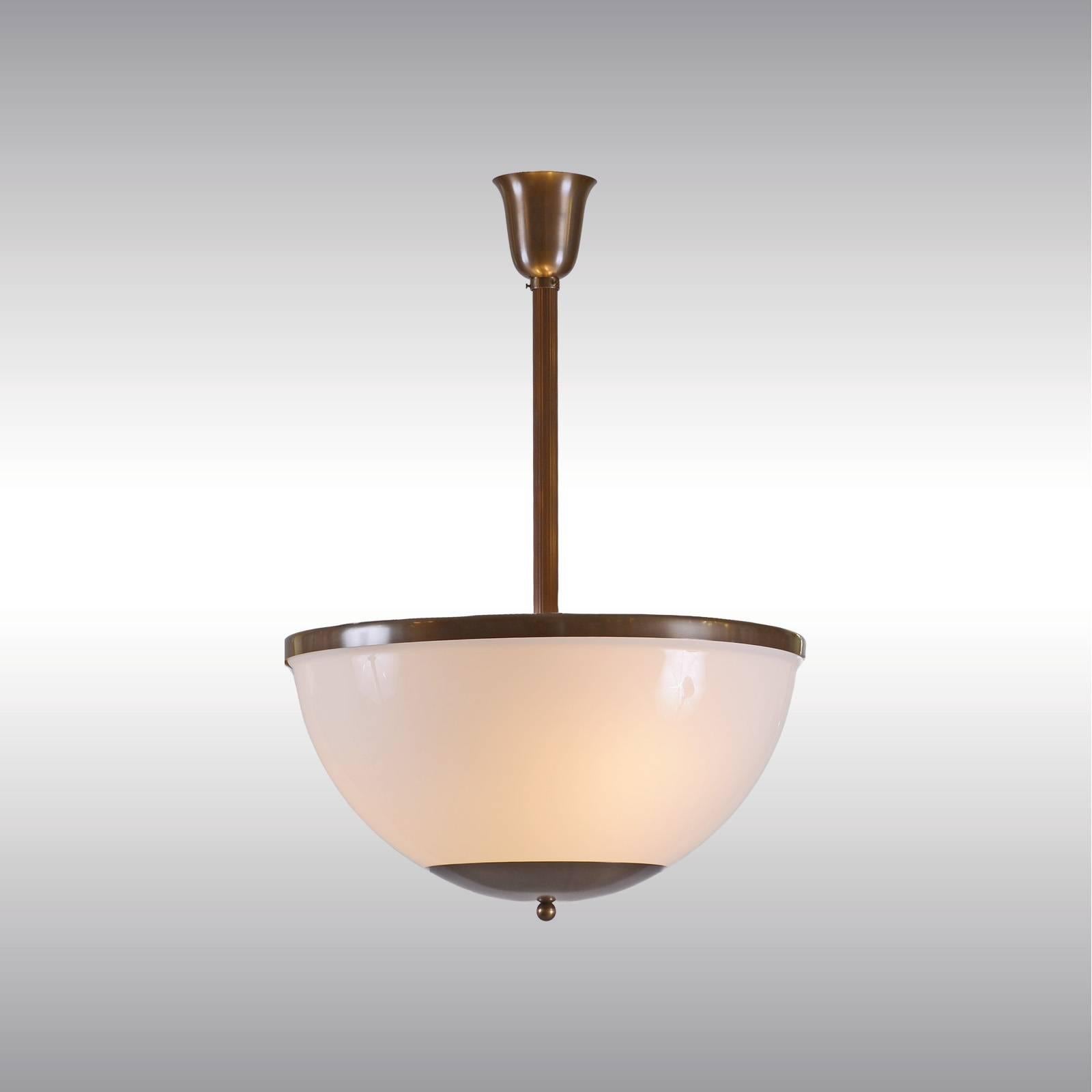 Ceiling light with Opaline glass shade comes as well as a downlight
Brass, optionally varnished or nickel-plated, all other surfaces on request, Opaline-glass, handblown.
Length of the lamp can be customized. Lampshade is available in different