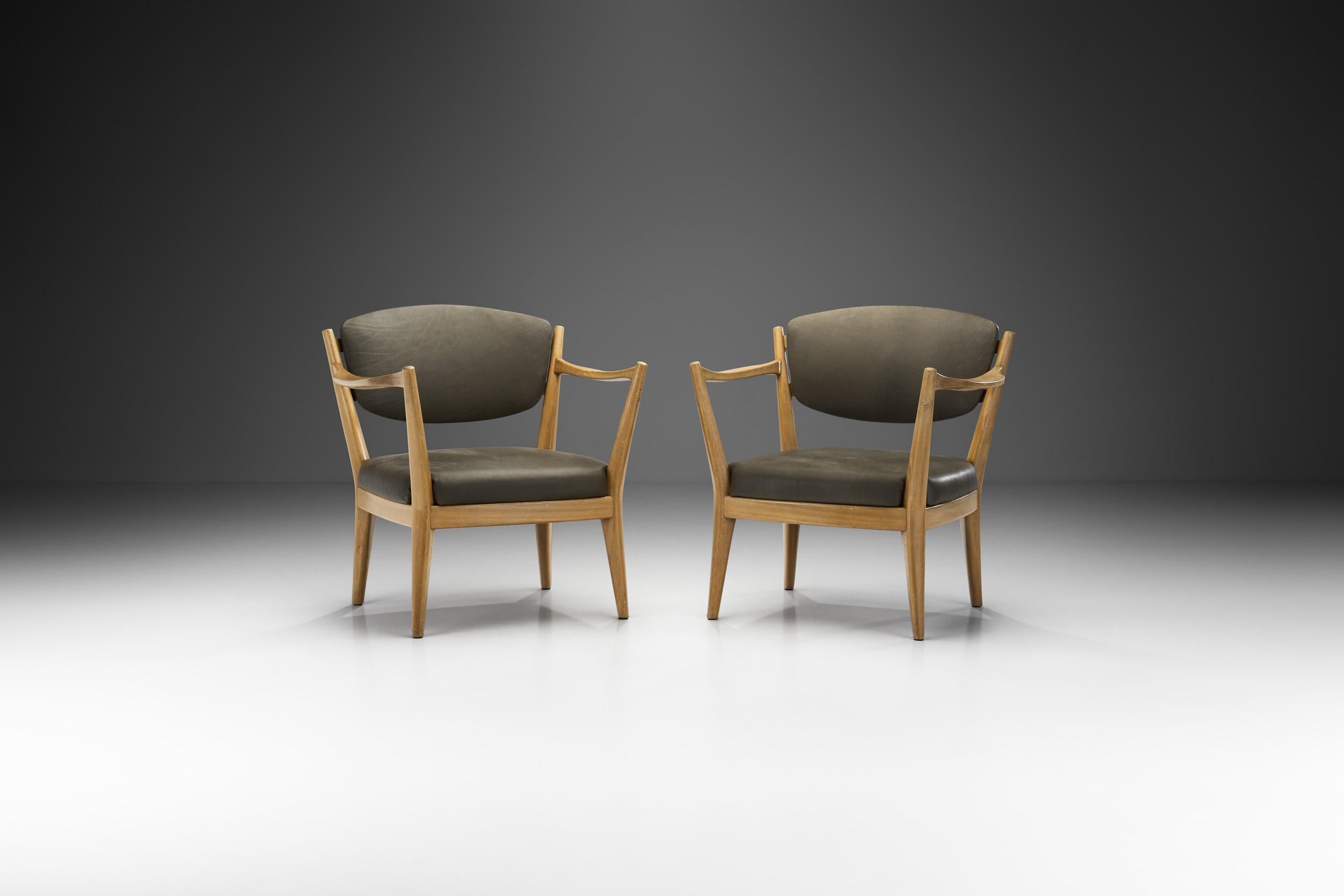 Designed in 1946 by Norwegian designers, Adolf Relling & Frederik Kayser, these so called “Kaminstolen” are a distinct pair thanks to their peculiar frame. The name can be roughly translated as “fireplace or stove chair”. Besides the unique look,