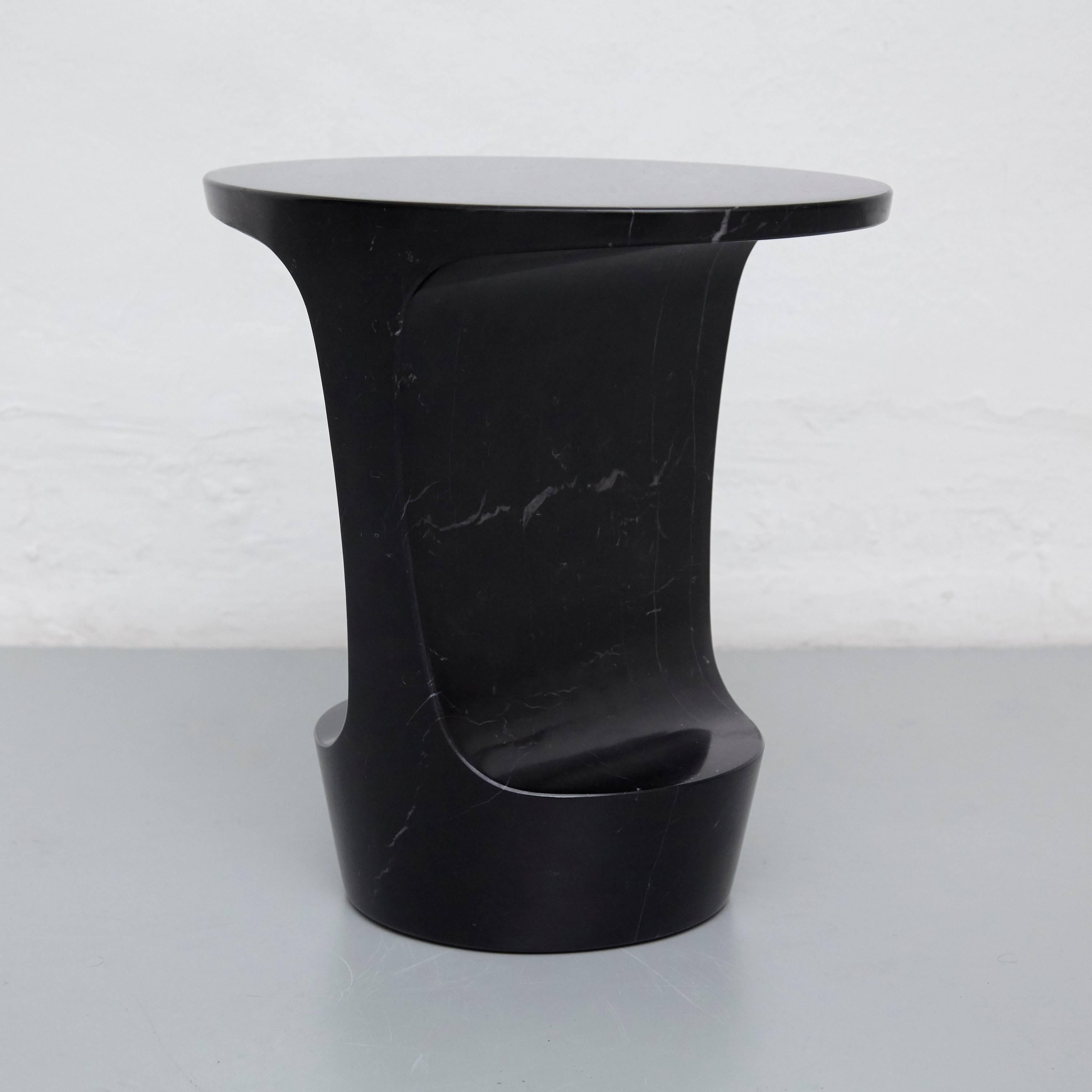 Side table designed by Adolfo Abejon.

Material:
Marquina marble or Carrara marble.

Finish:
Artisan polished.

Colors:
Marquina black or Carrara white.

Dimensions:
42 × 32 × 43 cm (L × W × H).

The marble of the piece will be