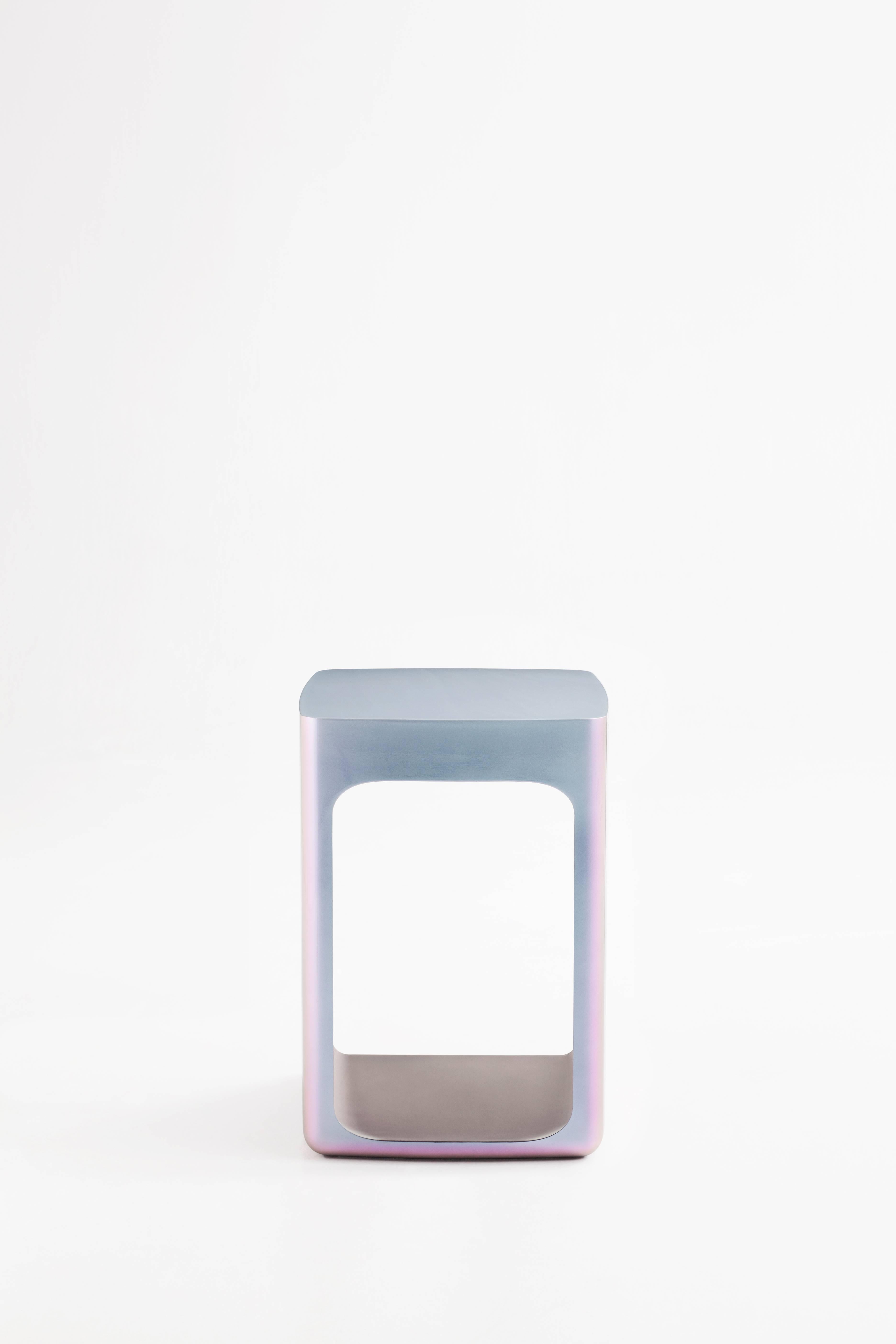 Adolfo Abejon 'Orion' side table manufactured in Barcelona.

Orion is a side table made in resine composite. It is versatile, because its design allows objects to be placed inside its inferior cavity as well as on top of it. This piece works as a