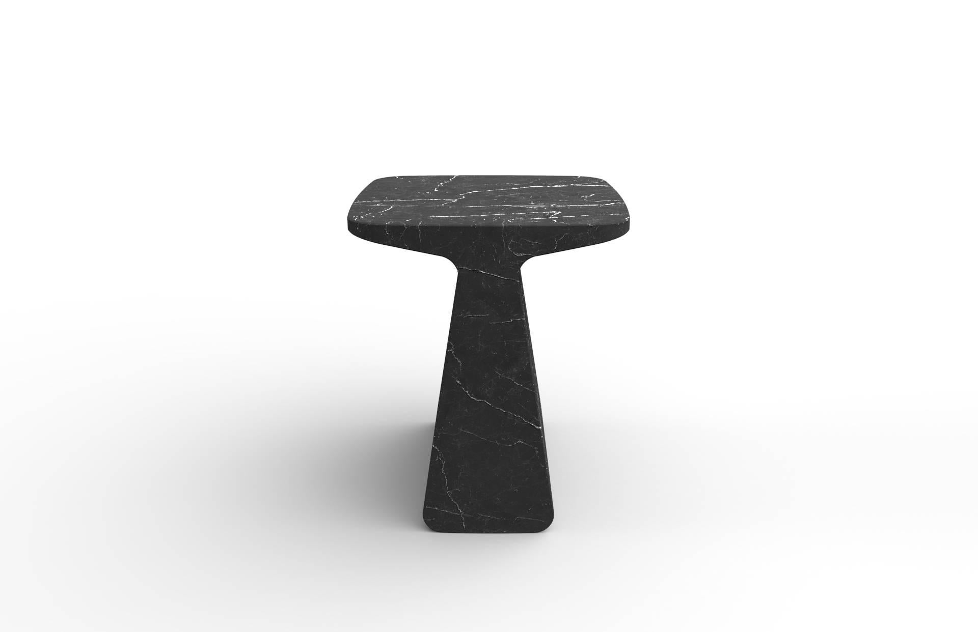 Pura is a side table extracted from a Marquina marble block. Solid and contained, either like a table, a base or a stool, Pura emanates presence and stillness. It's available in white and black marble and its finish is matte.

Side table designed