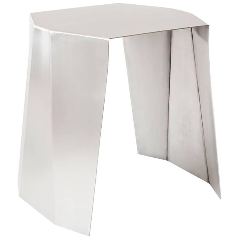 Side table designed by Adolfo Abejon.

Material: stainless steel.

Dimensions: 45 × 40 × 45 cm (L × W × H). 

Katy is a side table, but, above all, it's a feeling for sculpture handmade in a stainless steel sheet. Katy is born performing