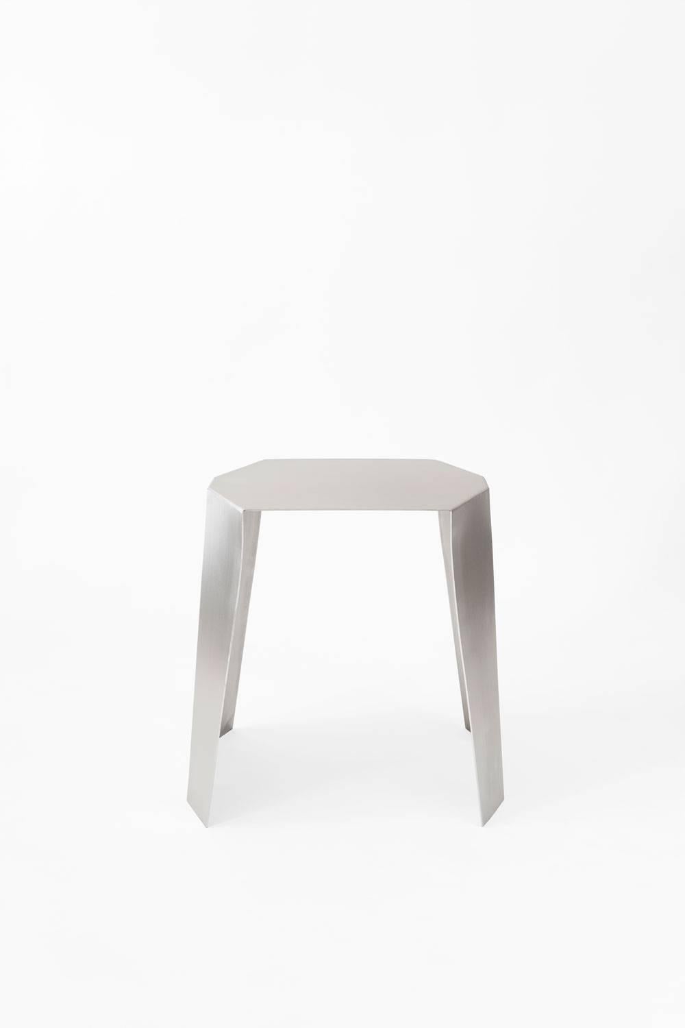Side table designed by Adolfo Abejon.

Material: Stainless steel.

Dimensions: 45 × 40 × 45 cm (L × W × H). 

Katy is a side table, but, above all, it's a feeling for sculpture handmade in a stainless steel sheet. Katy is born performing