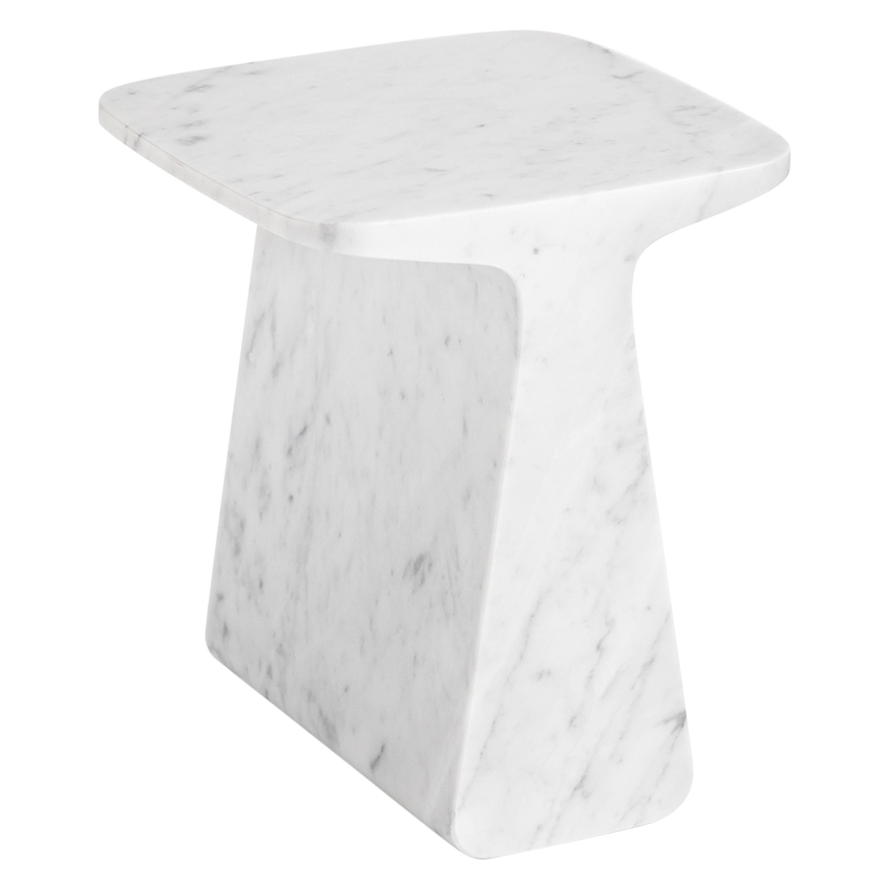 Pura is a side table extracted from a Carrara marble block. Solid and contained, either like a table, a base or a stool, Pura emanates presence and stillness. It's available in white and black marble and its finish is matte.

Designed by Adolfo