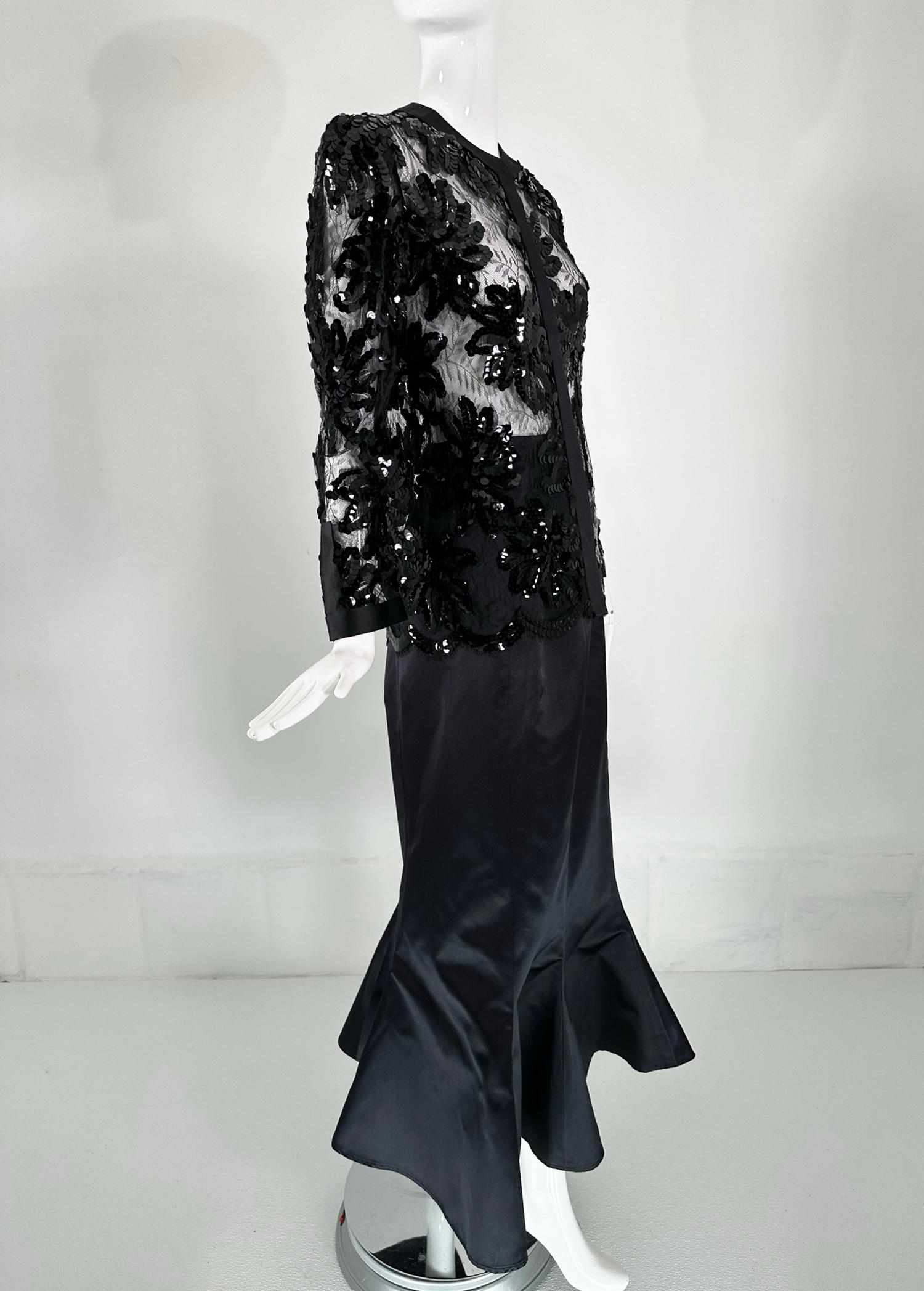 Adolfo black silk, sequins & lace jacket  with matching black silk long mermaid skirt from the 1970s. The lace jacket is sewn with black sequins the outline many of the floral designs.  The facings are done in black silk, including the neck fronts &