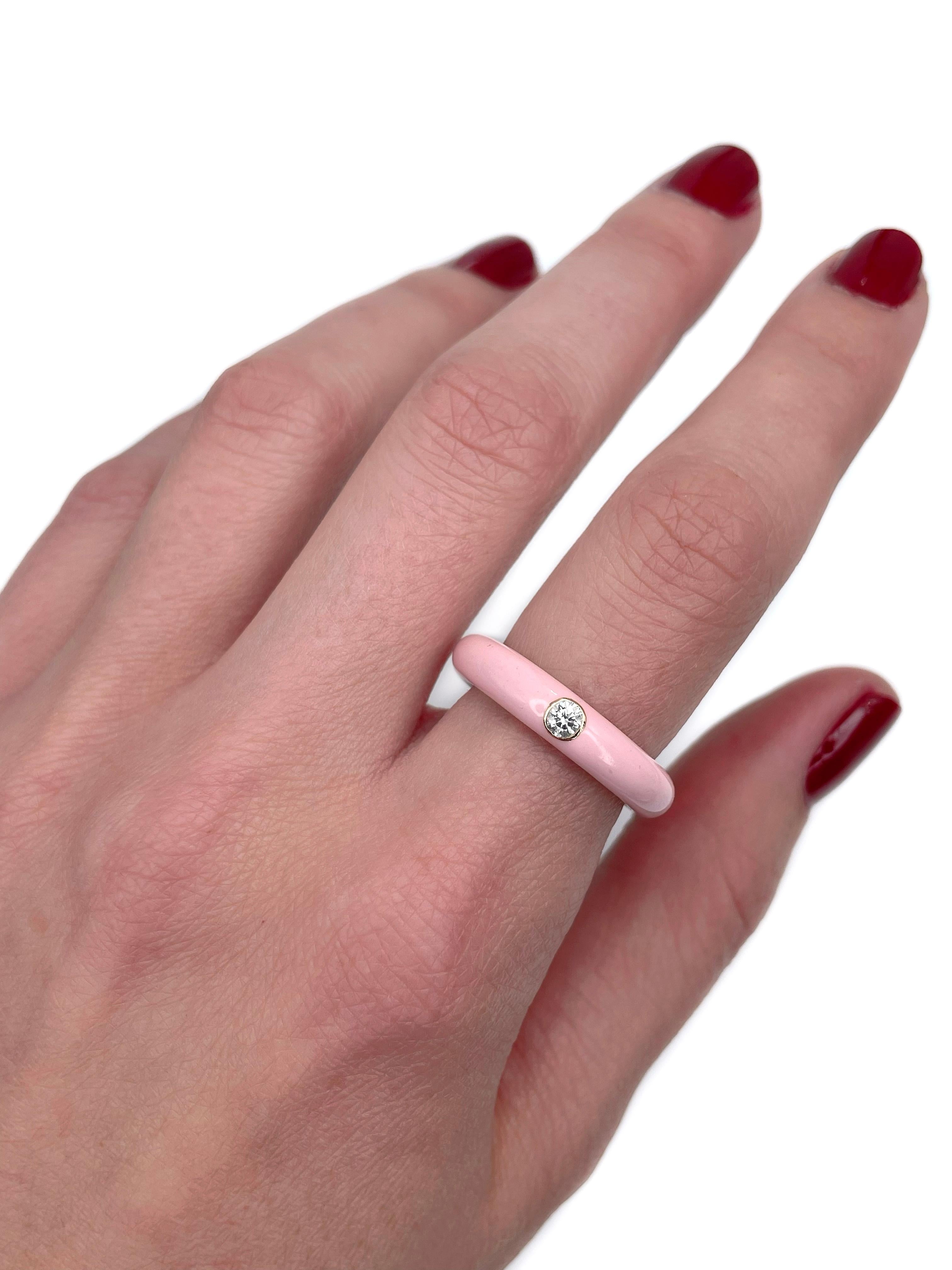 This is a modern band ring designed by the Italian jewellery company “Adolfo Courrier”. 

The piece is crafted in 18K rose gold and light pink enamel. It features ~0.10ct brilliant cut diamond.

Signed: Adolfo Courrier. Handmade in Italy.