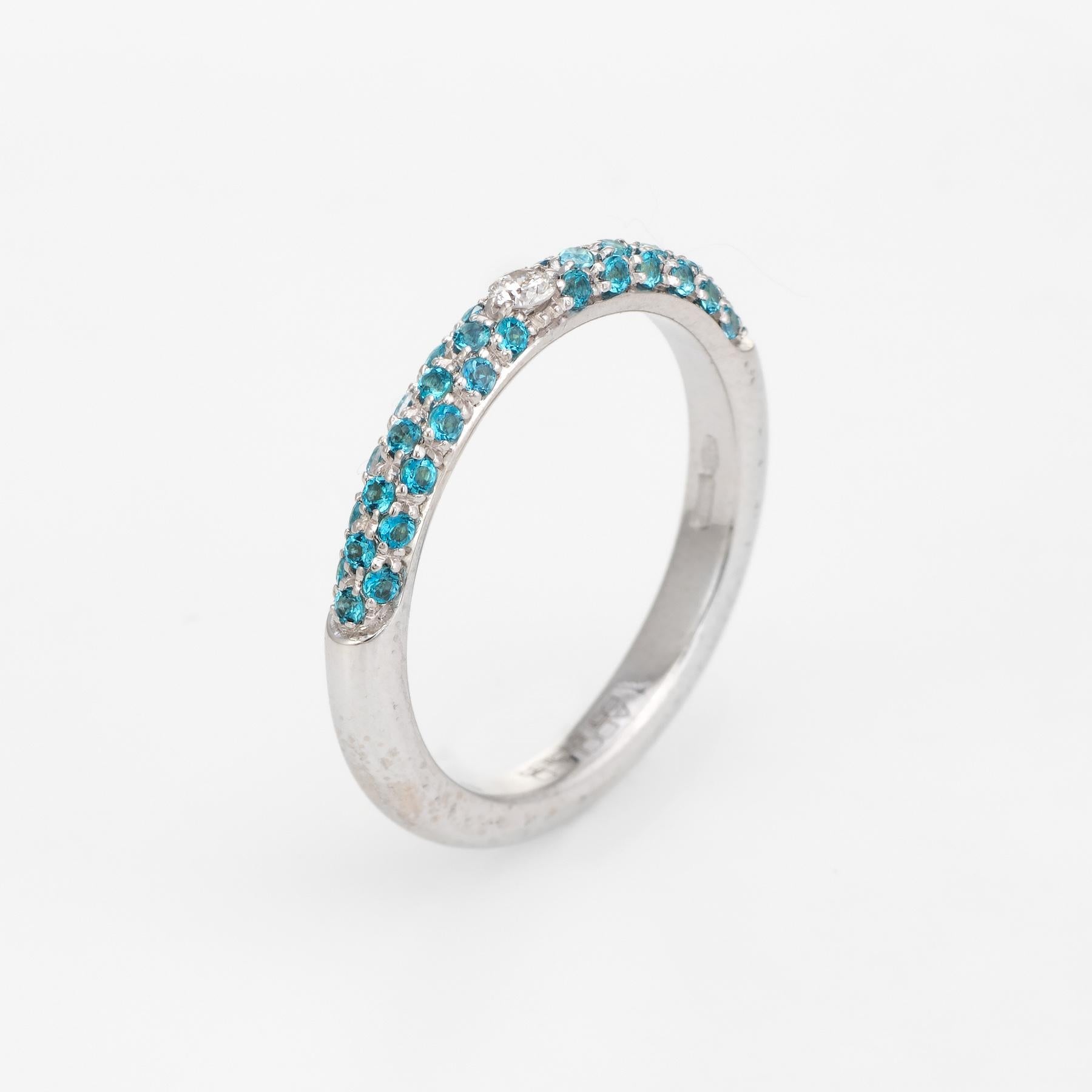 Elegant Adolfo Courrier stacking ring, crafted in 18 karat white gold. 

One estimated 0.11 carat round brilliant cut diamond (estimated at G-H color and VS2 clarity), accented with an estimated 0.70 carats of pave set turquoise. The stones are in