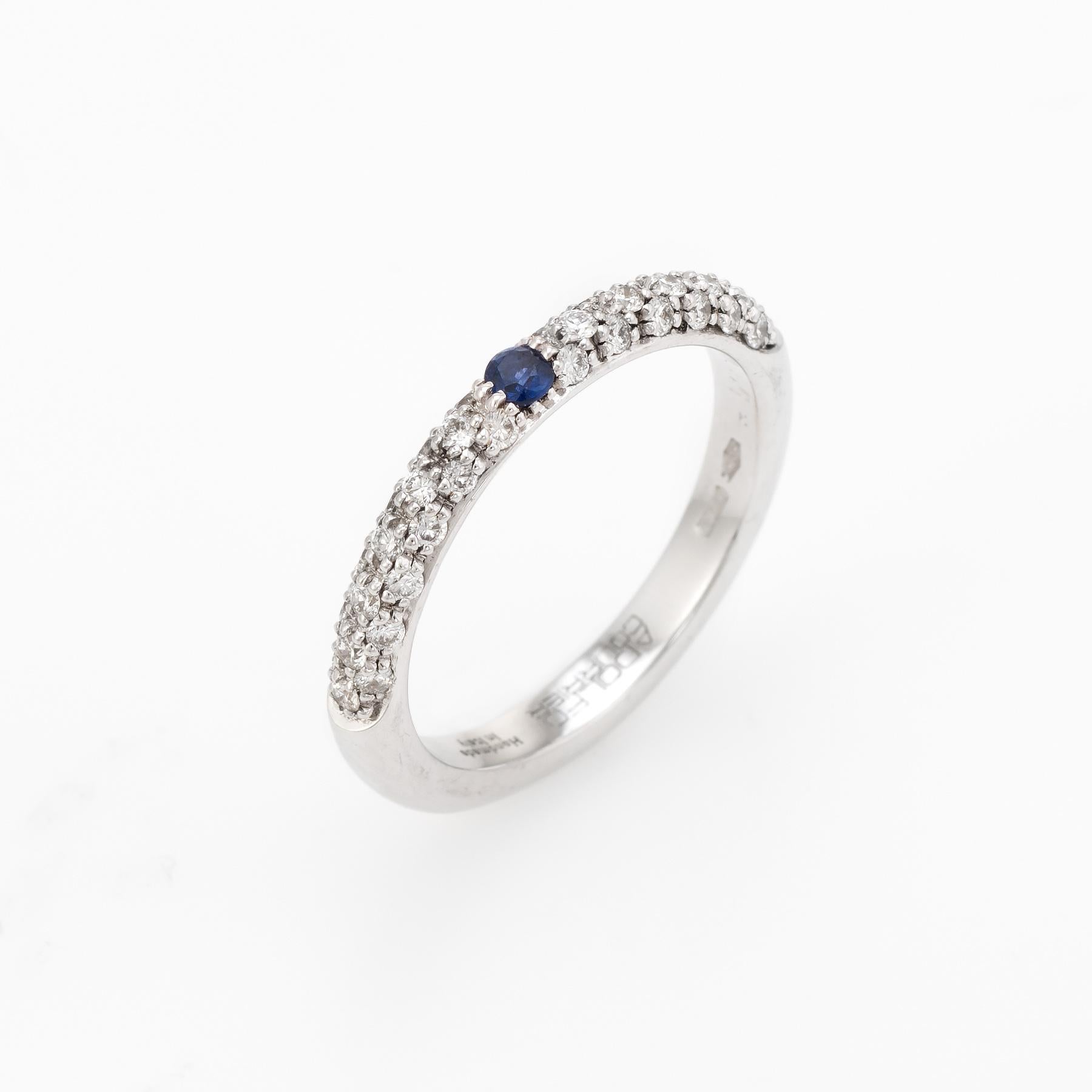 Elegant Adolfo Courrier stacking ring, crafted in 18 karat white gold. 

One estimated 0.05 carat sapphire, accented with 36 estimated 0.01 carat round brilliant cut diamonds totaling an estimated 0.36 carats (estimated at G-H color and VS2