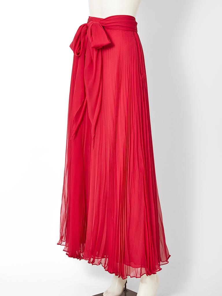 Adolfo, red, chiffon, crystal pleated, bias cut maxi skirt, having a matching self tie at the waist.
