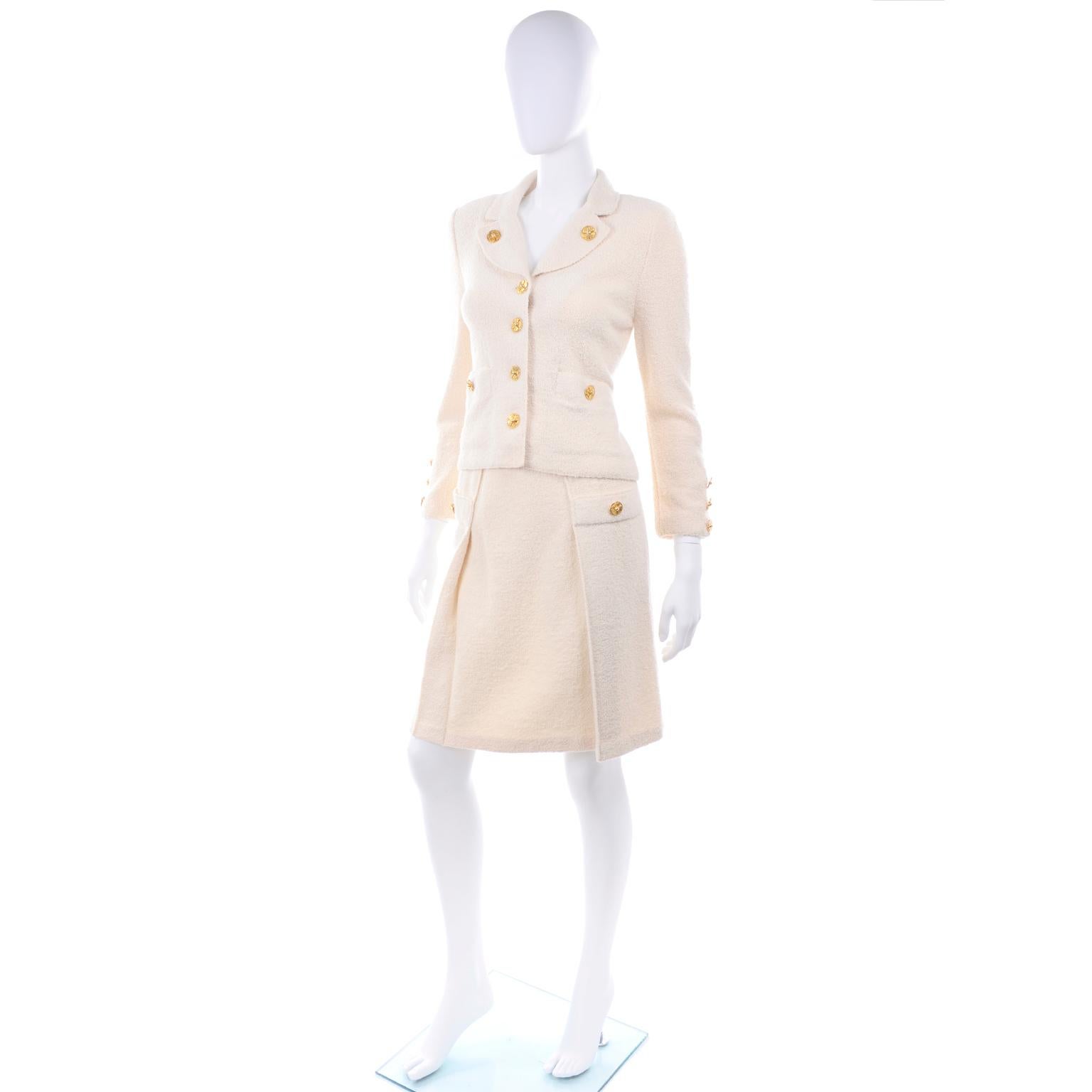 This is a really nice Adolfo for Saks Fifth Avenue vintage creamy ivory knit skirt suit with nice gold buttons.  We really love Adolfo suits and have been collecting them for quite some time now.  This is a great day dress alternative and is easy to