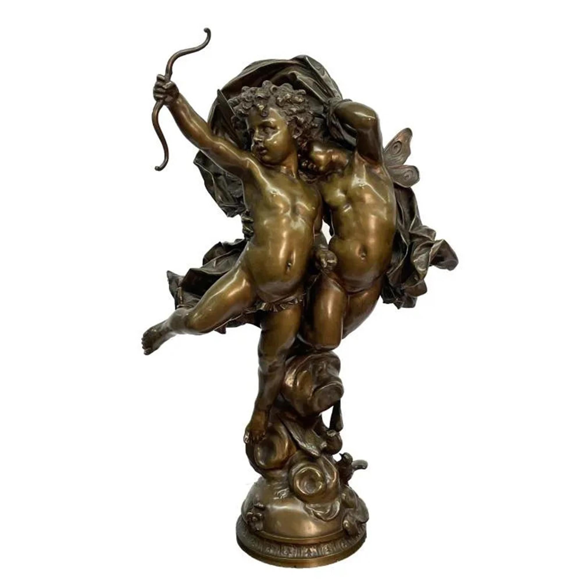 An Exquisite bronze figural pairing of two putti with butterfly wings. One putti holds a bow, while his counterpart cowers behind him. A dynamic piece of fabric hovers over the grouping, showcasing expertly modeled drapery, embellishing the
