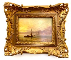 Antique 19th century English Fishing boat at sea with Sun rise or Sunset