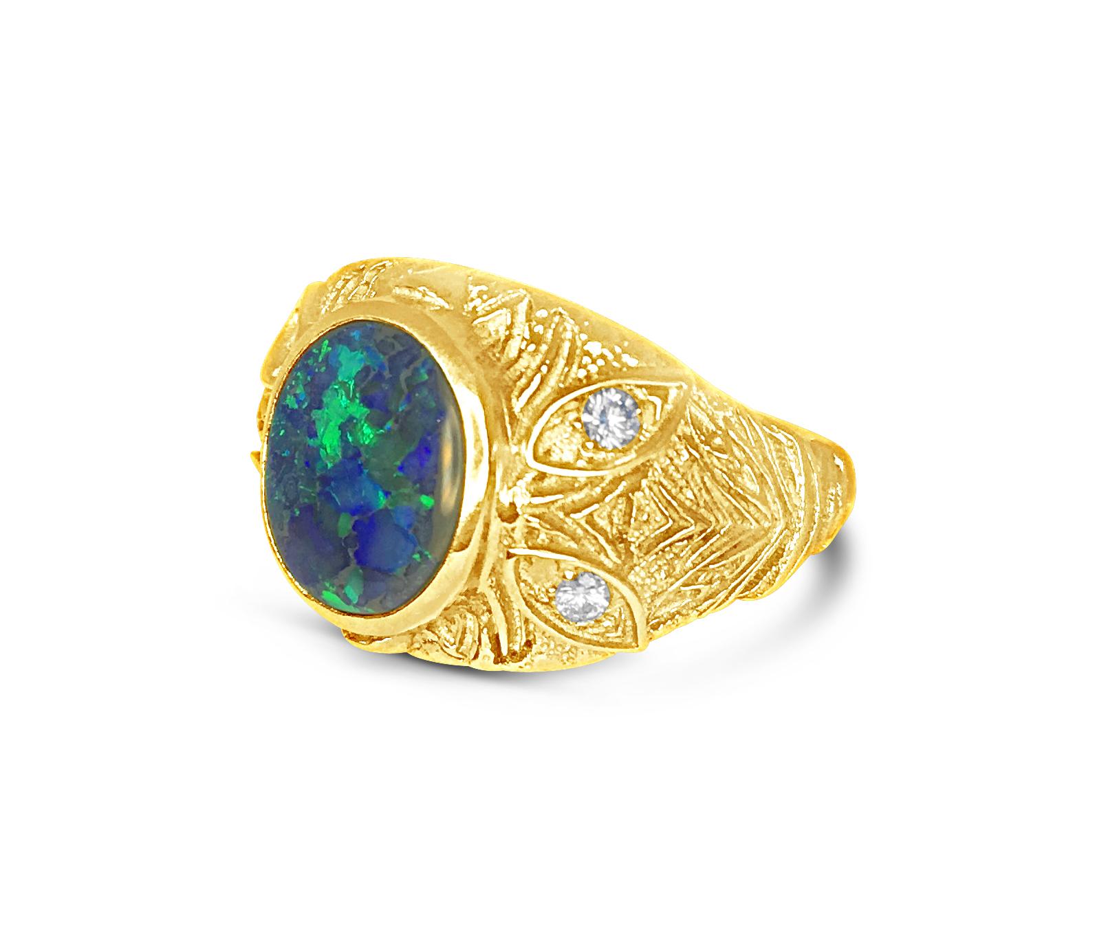 Radiantly textured gold sets off the black Australian Opal play of blue and green colors. The design of the A'donna collection lets the Diamonds shine as accents in this beautiful ring designed by Katherine LeGrand of Aspen, Colorado.

18kt Yellow