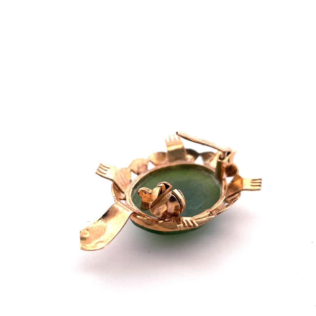 Adorable 14K Yellow Gold Turtle Brooch with Jade Cabochon

Add a touch of whimsy to your jewelry collection with this adorable 14K yellow gold turtle brooch. The brooch features a stunning jade cabochon, perfectly set in the center of the turtle's