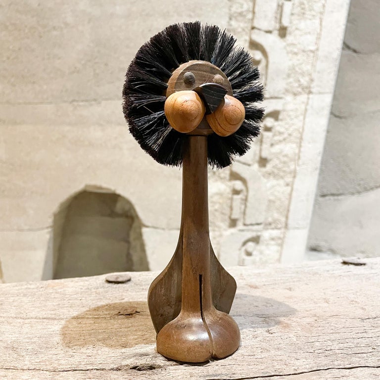 We are pleased to offer fabulous fun vintage for you:
1960s teak lion brush toy by Gunnar Florning for Laurids Lonborg 
Made in Denmark 1960s. Simply adorable!
Dimensions: 7.5 height x 3.5 diameter x 2.5 D.
Teak wood and plastic.
Very good