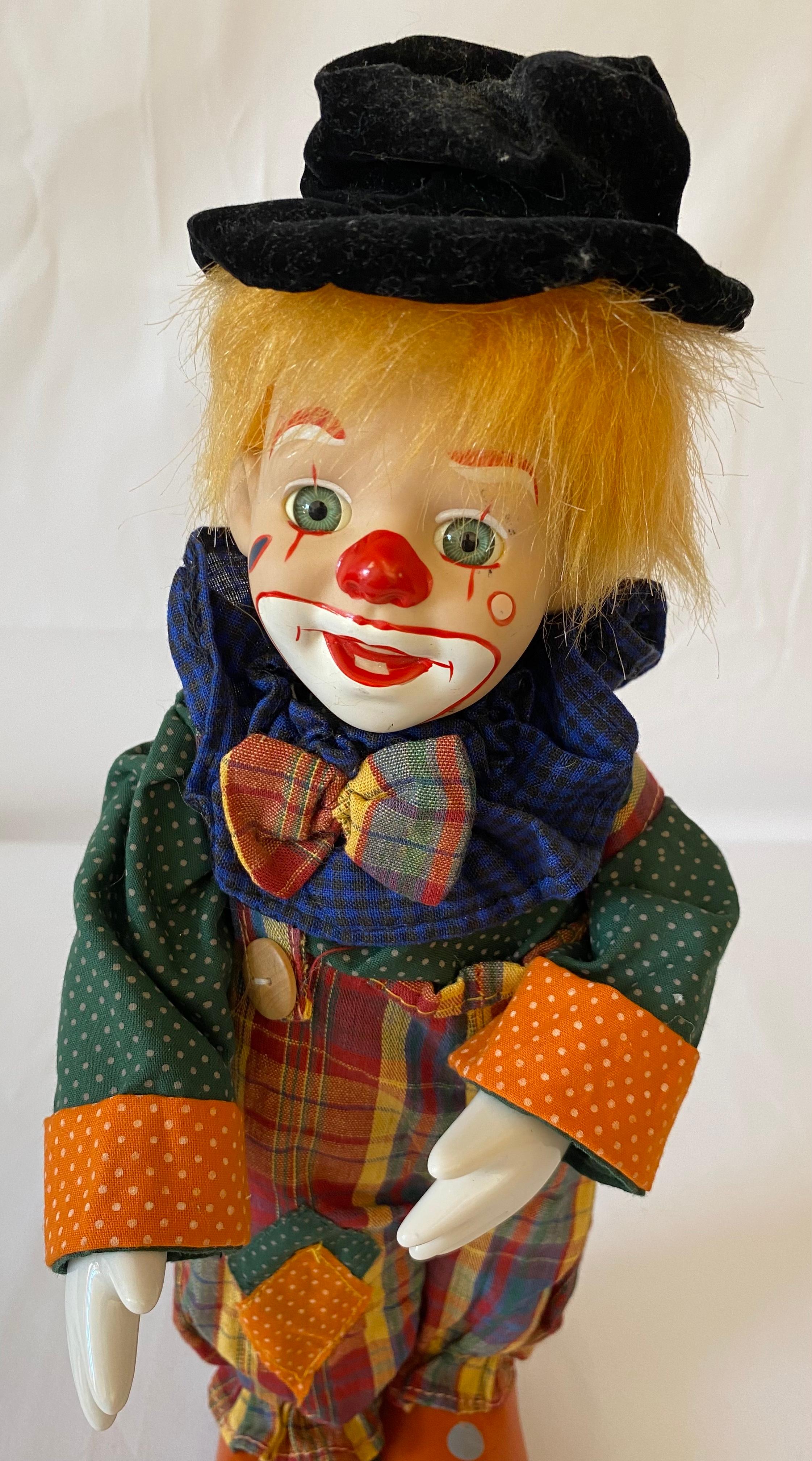 A fine quality therapeutic musical automaton clown toy in wonderful vintage condition.
Features porcelain head, hands and feet. 
Made in France during the 1950s and is in perfect working condition.
Wind-up to hear the delightful music of this