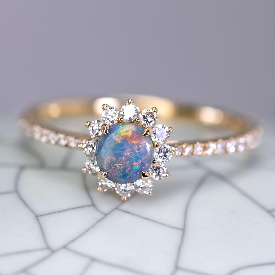 Adorable Australian Black Opal Halo Diamond Engagement Ring 18K Yellow Gold.


Free Domestic USPS First Class Shipping!  Free One Year Limited Warranty!  Free Gift Bag or Box with every order!



Opal—the queen of gemstones, is one of the most