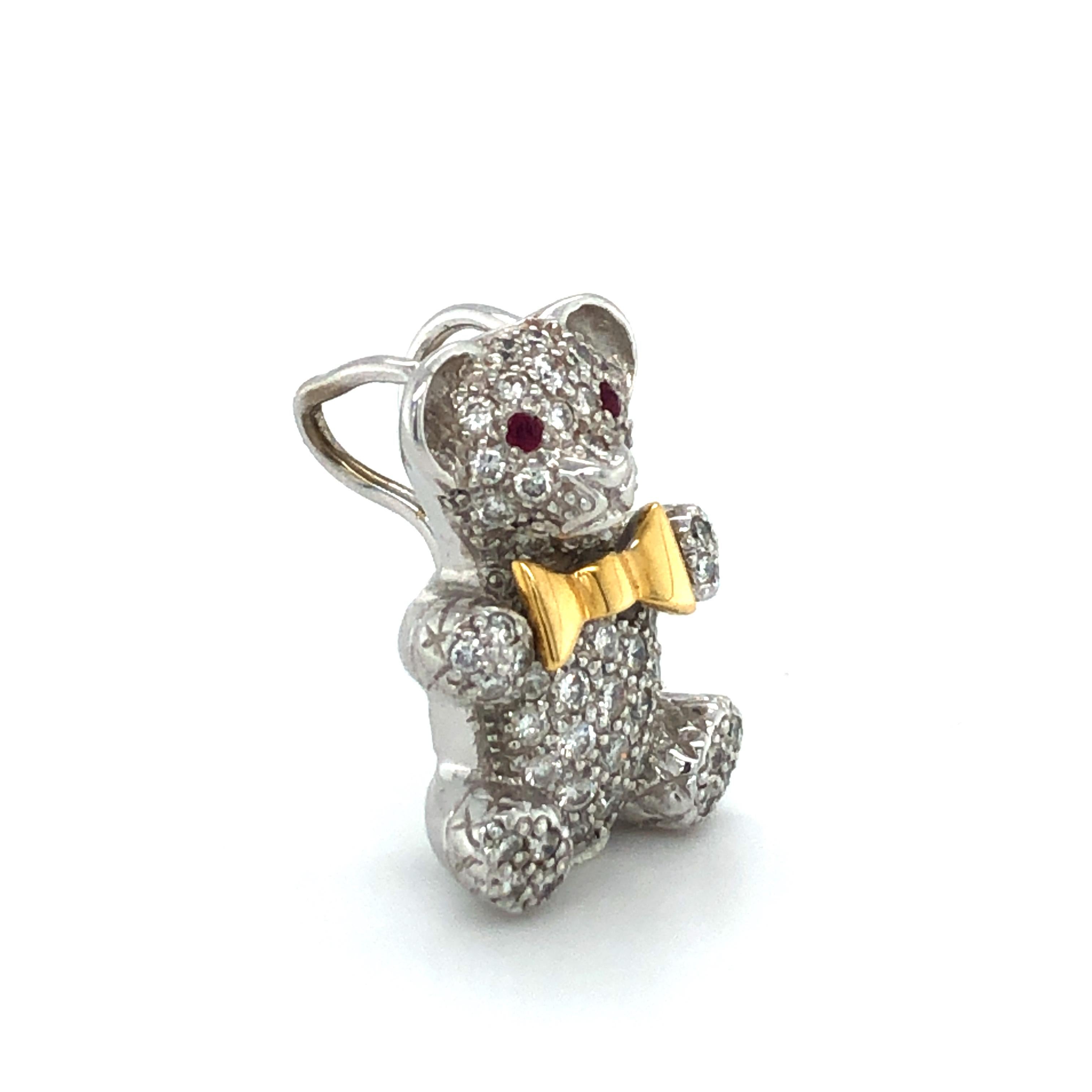 This cheerfully charming pendant in the shape of a teddy bear is set with a total of 53 brilliant-cut diamonds of G/H colour and vs clarity, total weight 0.70 carats.
The eyes are decorated with two round-cut rubies, and the whole outfit is rounded