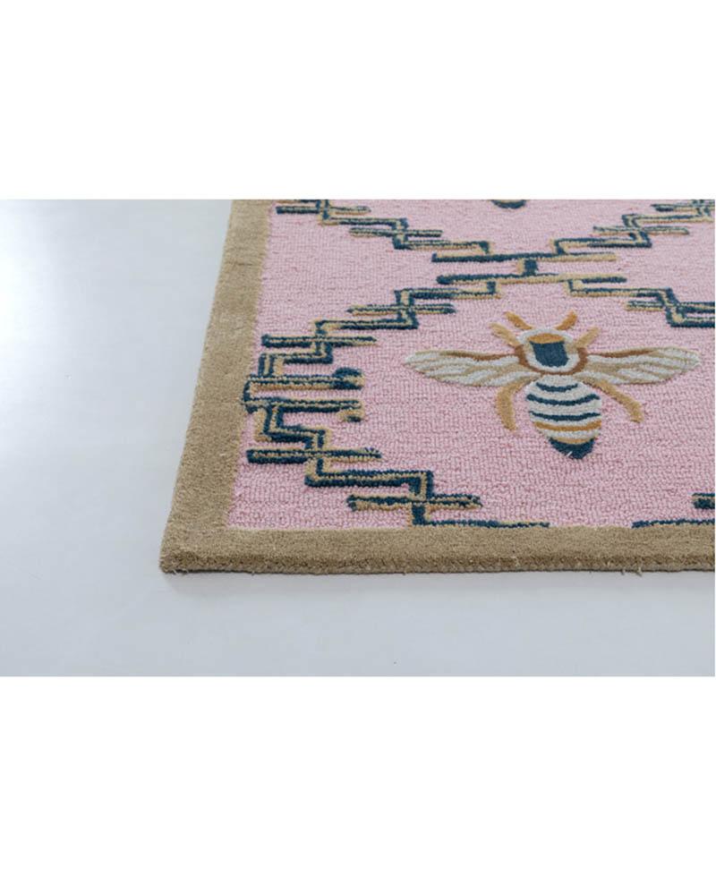 Introducing our charming Hand-Tufted Kids Bee Rug, a delightful addition to any child's space that combines quality craftsmanship with playful design. This enchanting rug is meticulously crafted from a blend of soft, durable wool and luxurious