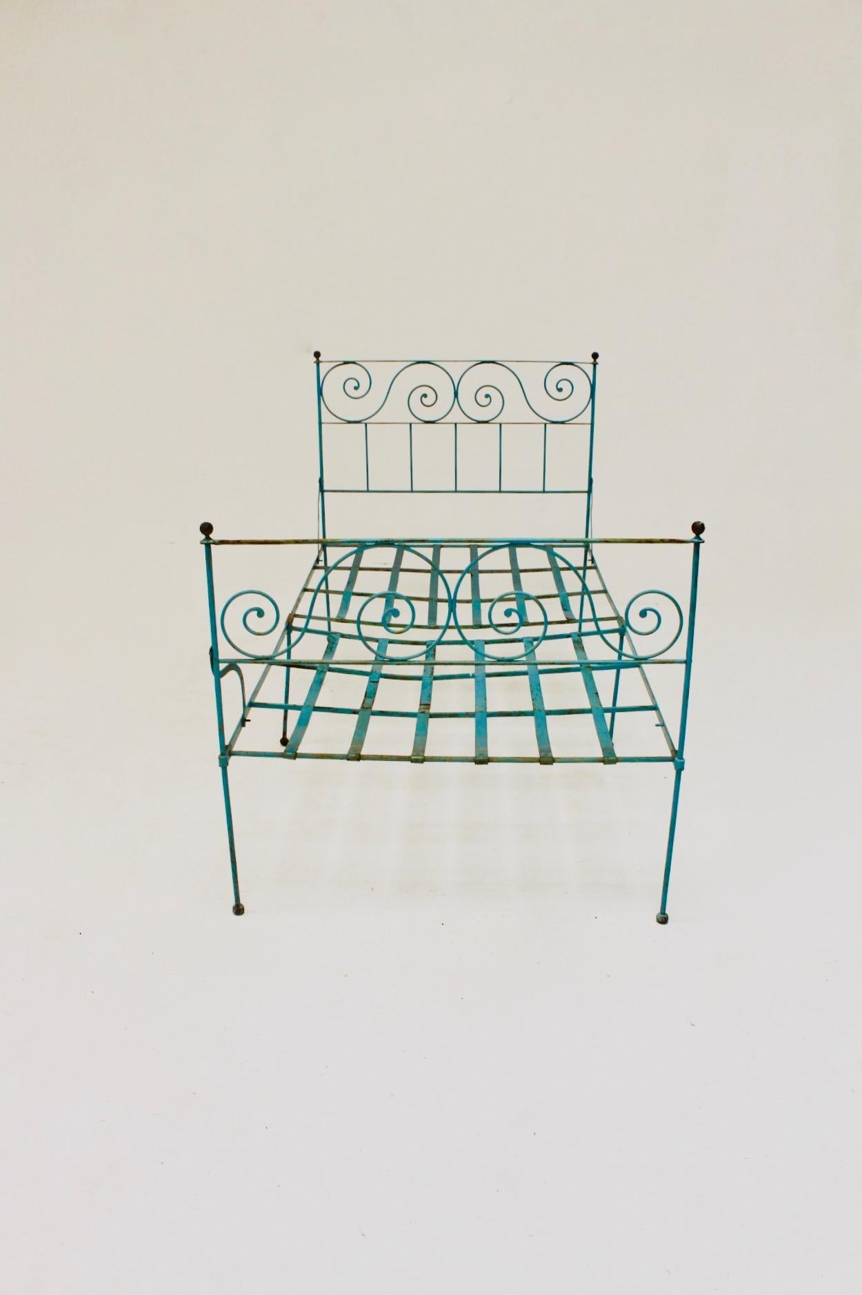 Adorable old blue iron folding bed, Spain, 19th century.

*One of the fixings, iron anchor, has been lost, marked with my finger in the photographs.
It is not affects the structural of the bed or the stability. Anyway, this lost piece can be