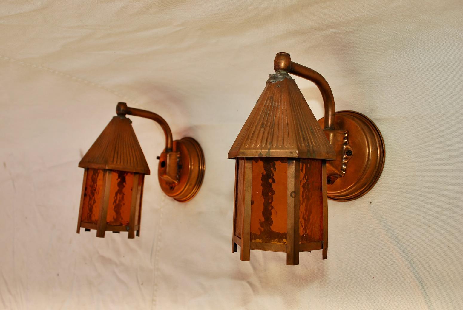 Adorable pair of 1940s outdoor copper sconces.

 