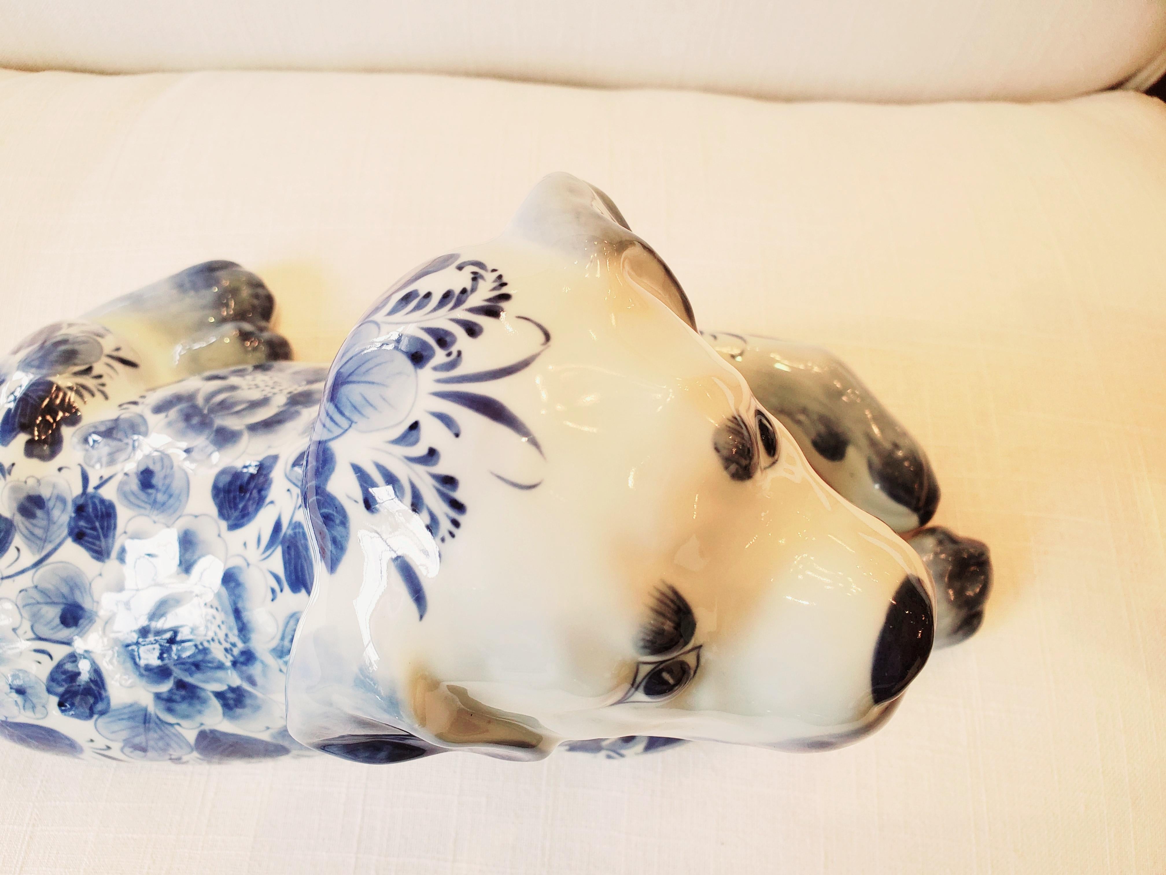 Late 20th Century Adorable Reclining Blue and White Porcelain Dog Sculpture