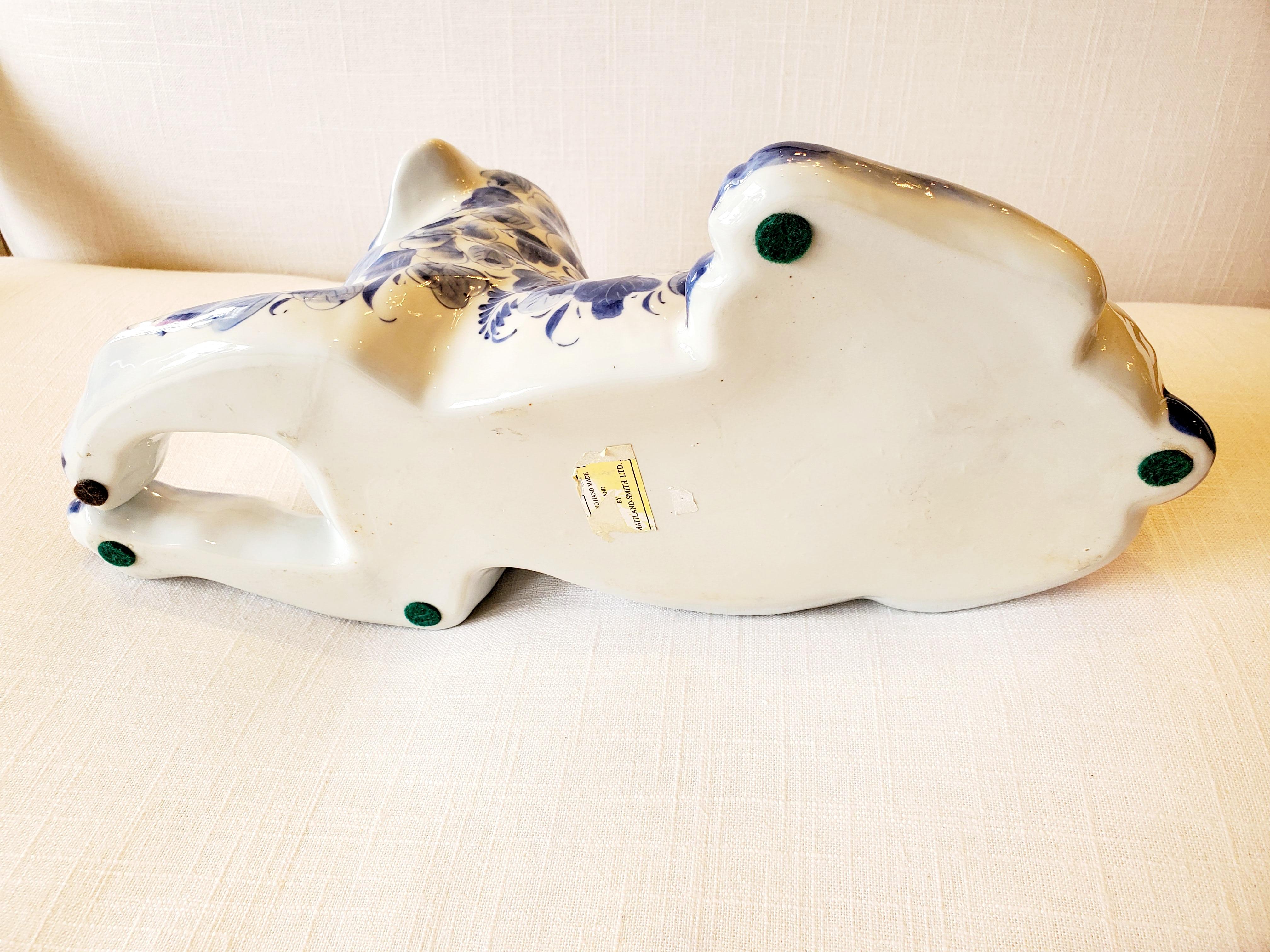Adorable Reclining Blue and White Porcelain Dog Sculpture 1