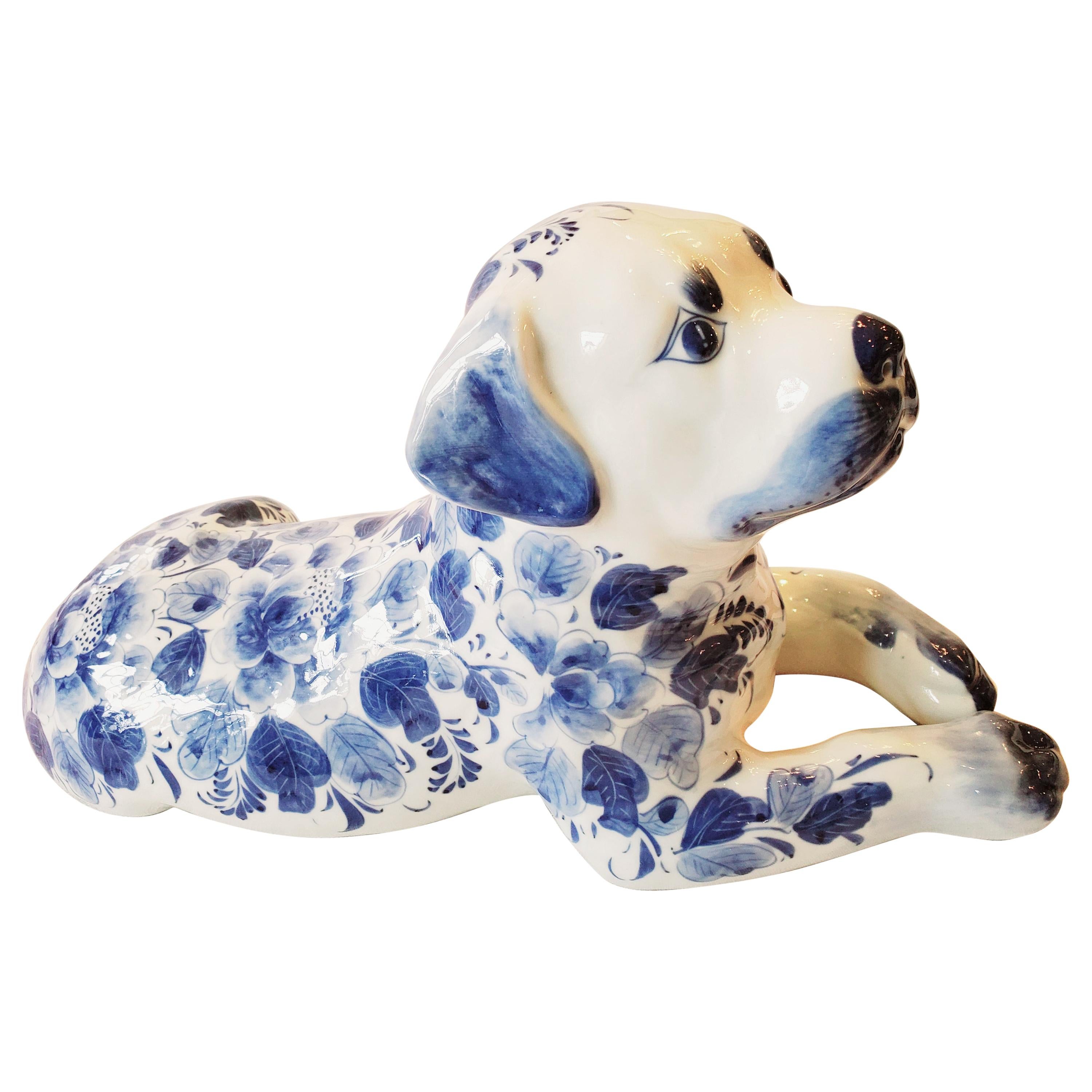 Adorable Reclining Blue and White Porcelain Dog Sculpture
