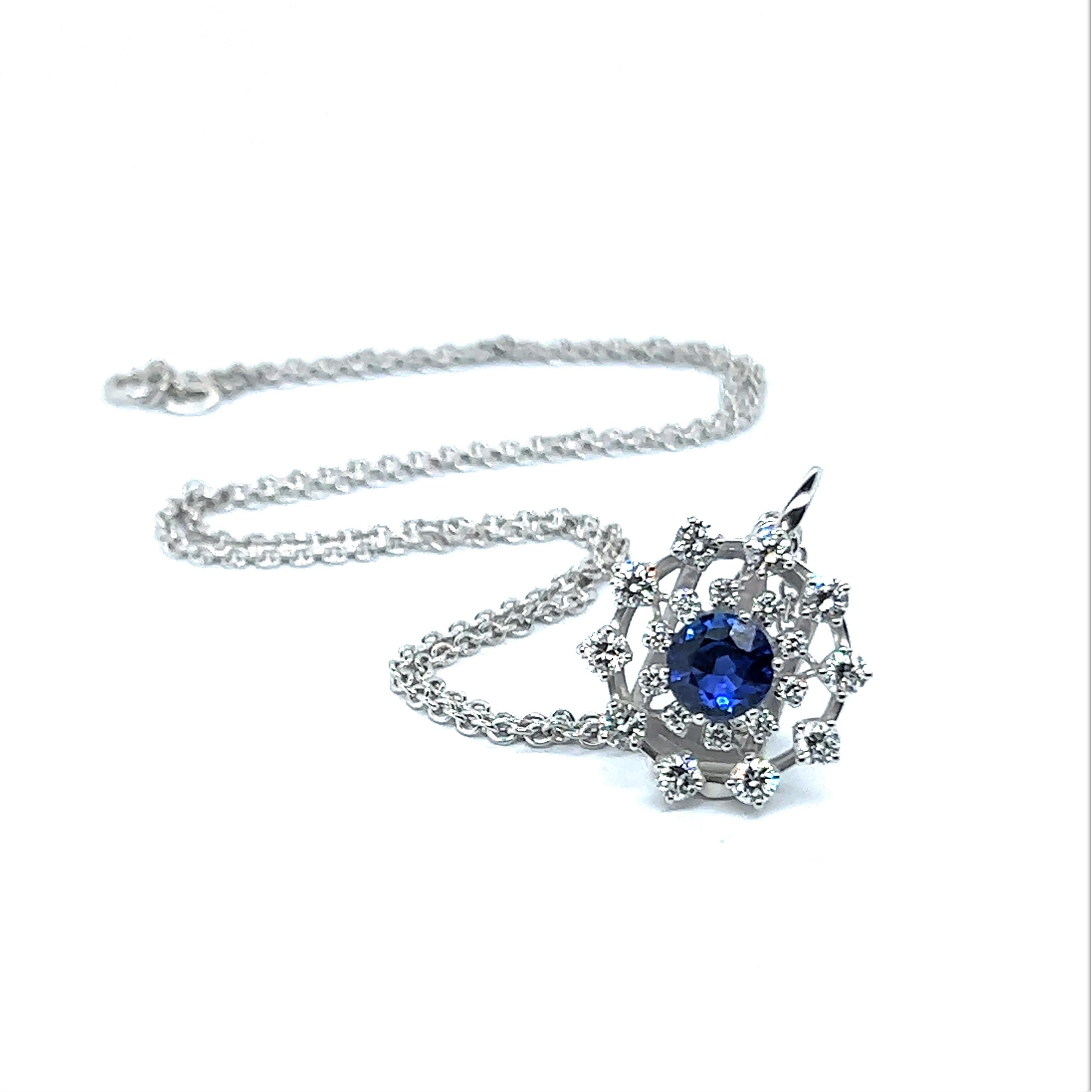 A chic diamonds sapphire pendant, shaped as an adorable little snowflake. First-class craftsmanship meets fine quality in this dear piece of jewelry. 

The centerpiece is a spectacular untreated natural sapphire of 1.59 carats and a rich vivid blue