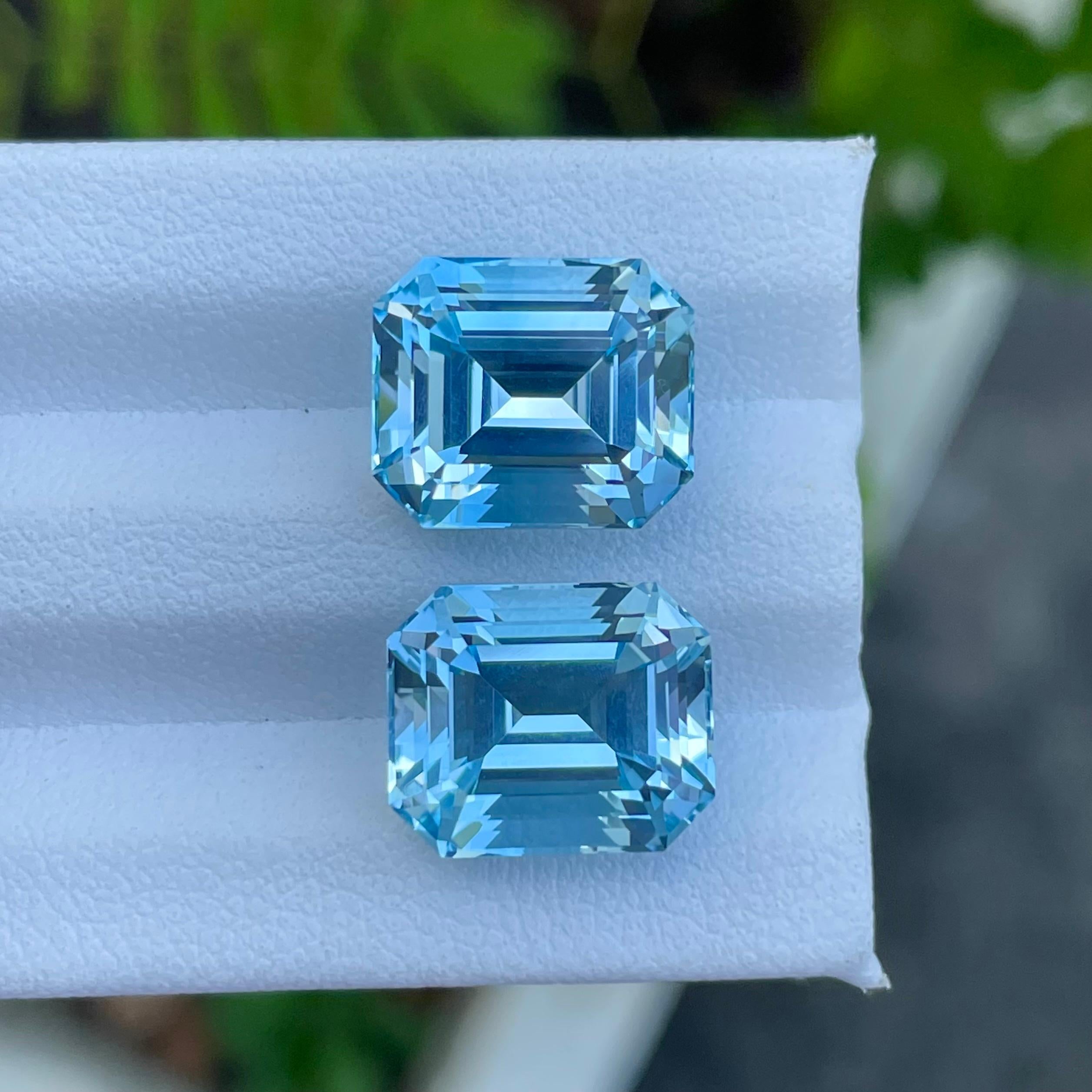 Modern Adorable Swiss Blue Topaz Pair 20.65 carats Emerald Cut Natural Madagascar's Gem For Sale