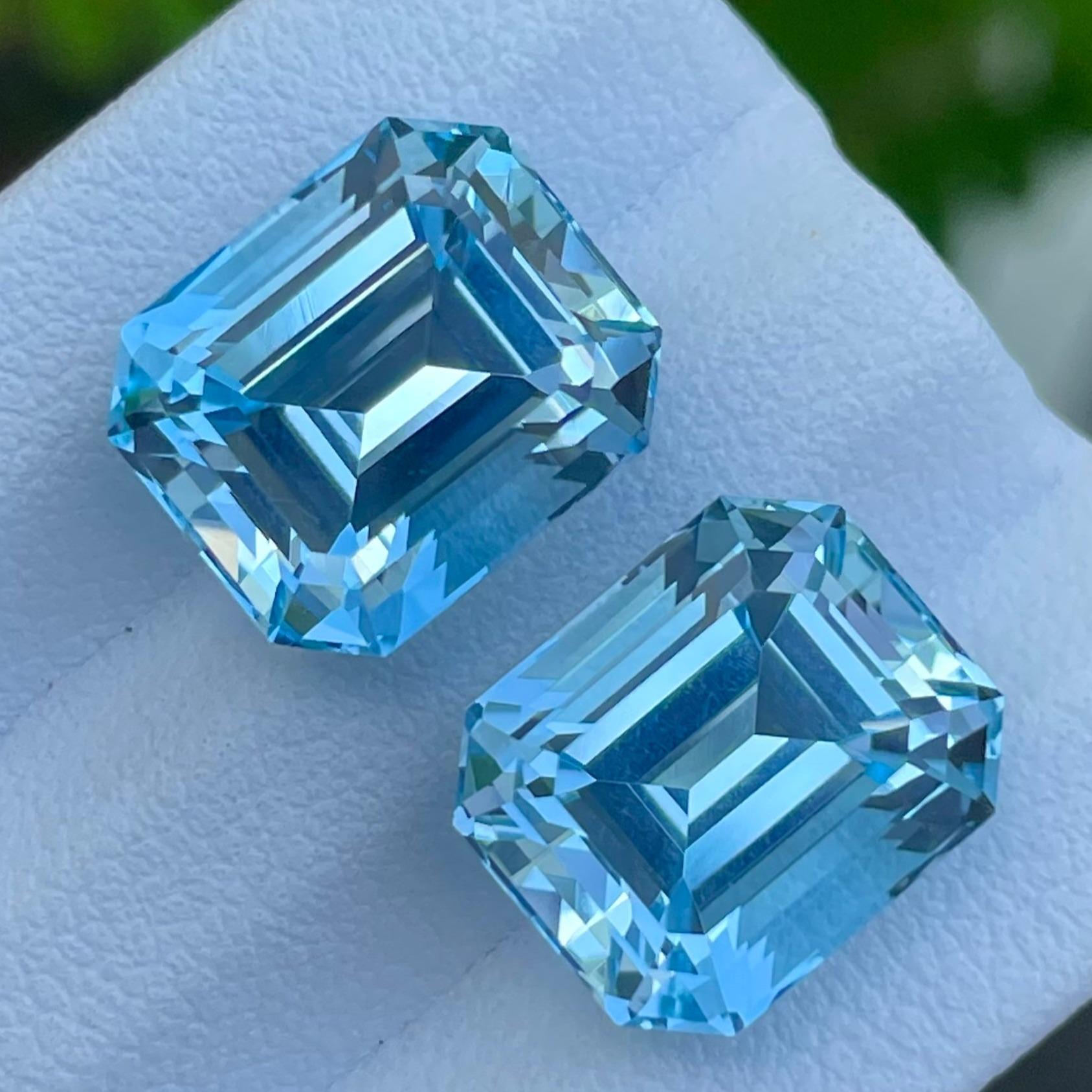 Women's or Men's Adorable Swiss Blue Topaz Pair 20.65 carats Emerald Cut Natural Madagascar's Gem For Sale