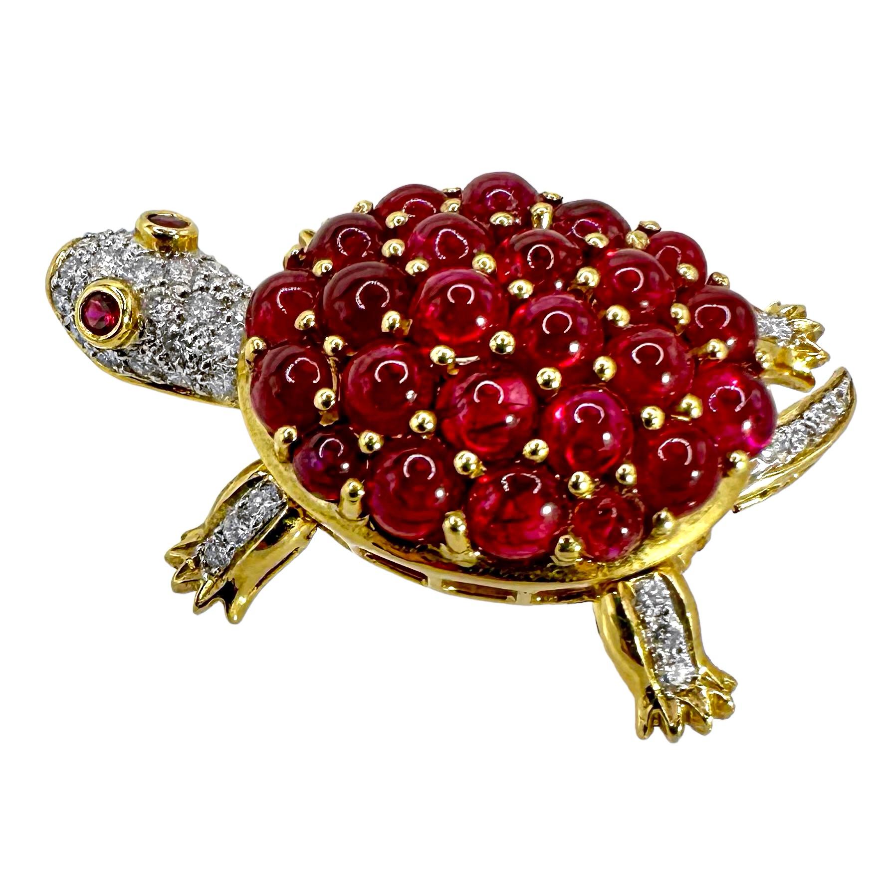 An amazing little movable terrapin in 18K yellow gold set with diamonds and rubies. The diamond encrusted head has two faceted, ruby eyes, and the turtle shell is set with vibrant, cabochon rubies. The four legs and the tail are set with round