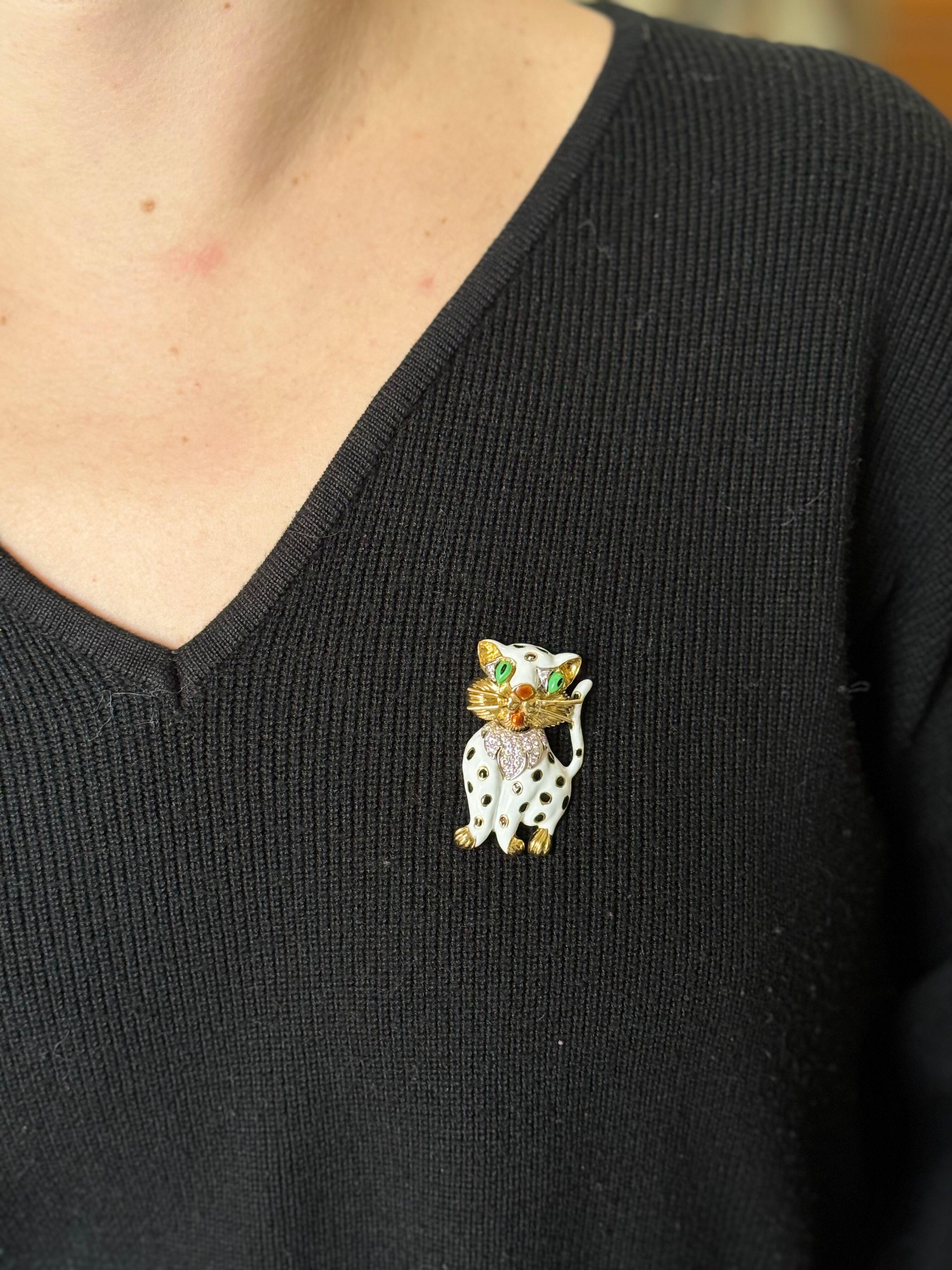 Adorable 18k Yellow Gold Enamel Diamond Cat Brooch

18k yellow gold cat brooch, adorned with multi color enamel and approx. 0.40ctw H/VS diamonds. Brooch measures 1 7/8