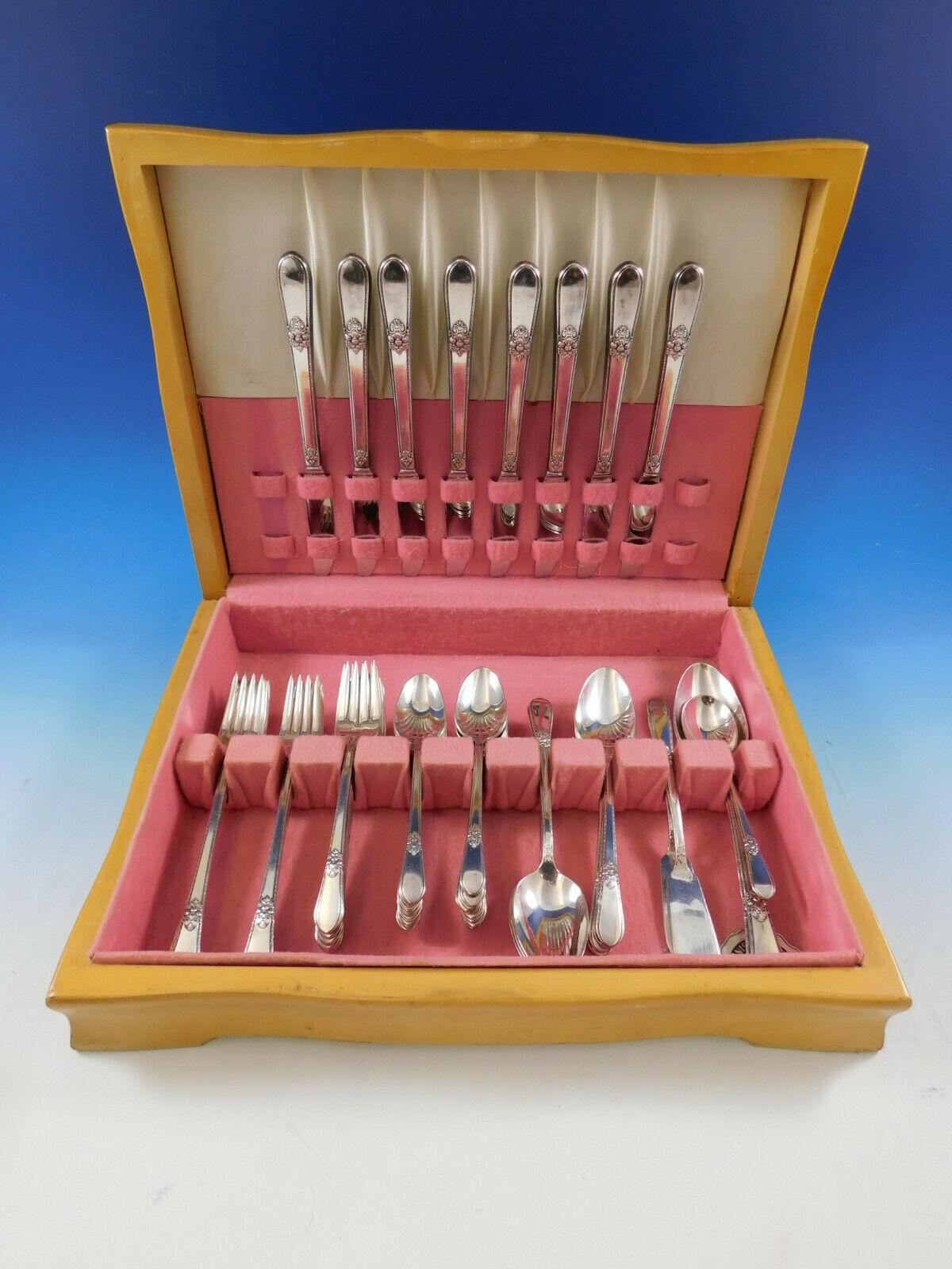 Adoration by 1847 Rogers Silverplate Flatware set, 53 pieces. This set is grille size with long handle knives and forks. This set includes:

 8 Grille Size Knives, 8 1/2