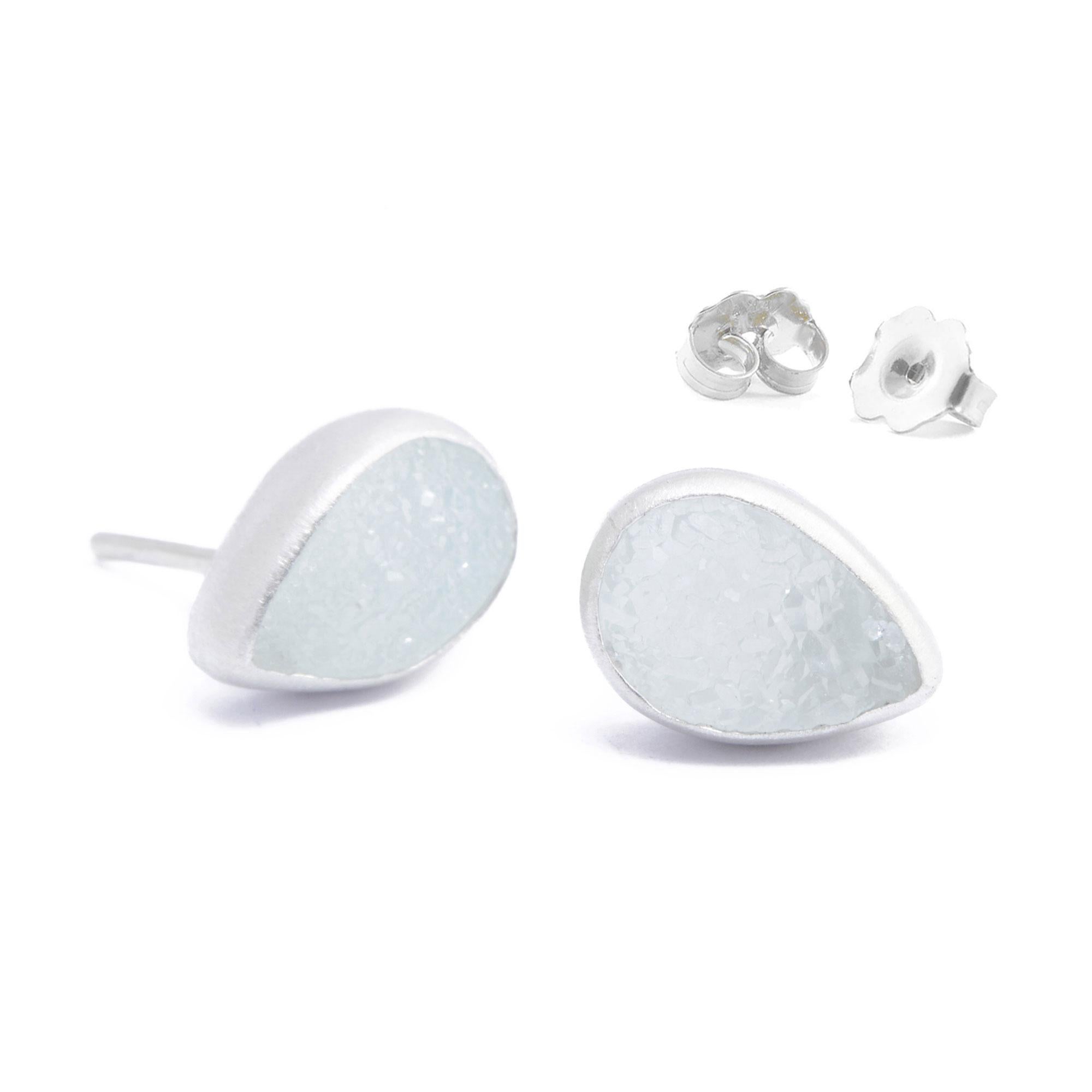 Organic and asymmetrical, and detailed with a aqumarine druzy for a bold, mysterious edge, the Adorn Petite Silver Studs go with everything in your closet.
Nina Nguyen Design's patent-pending earrings have an element on the back of the stud or charm